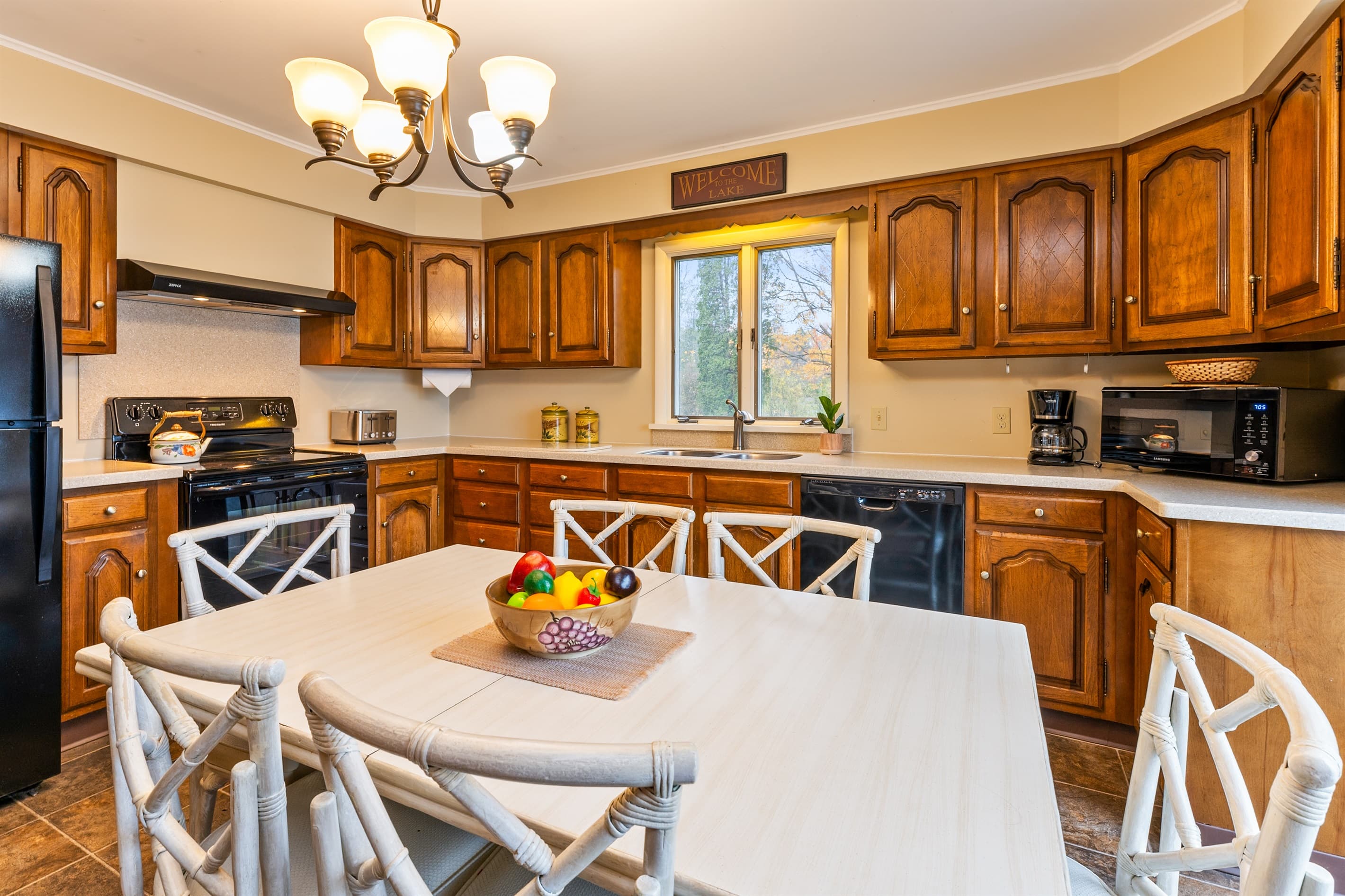 Spacious kitchen with white dining table