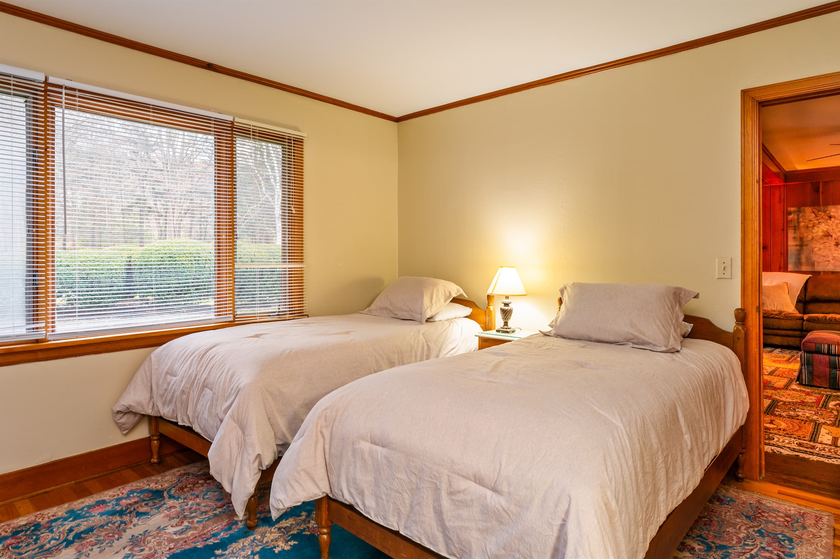 Bedroom with two beds and natural light