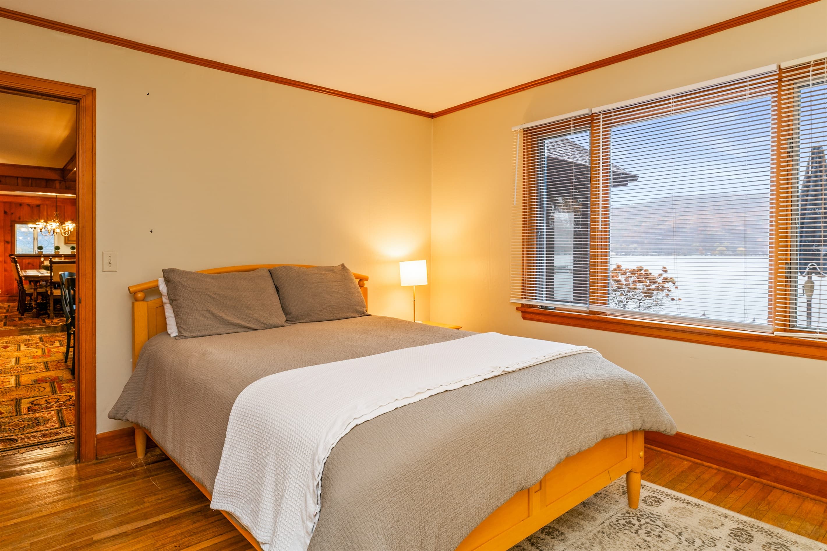 Main floor queen bedroom with large window