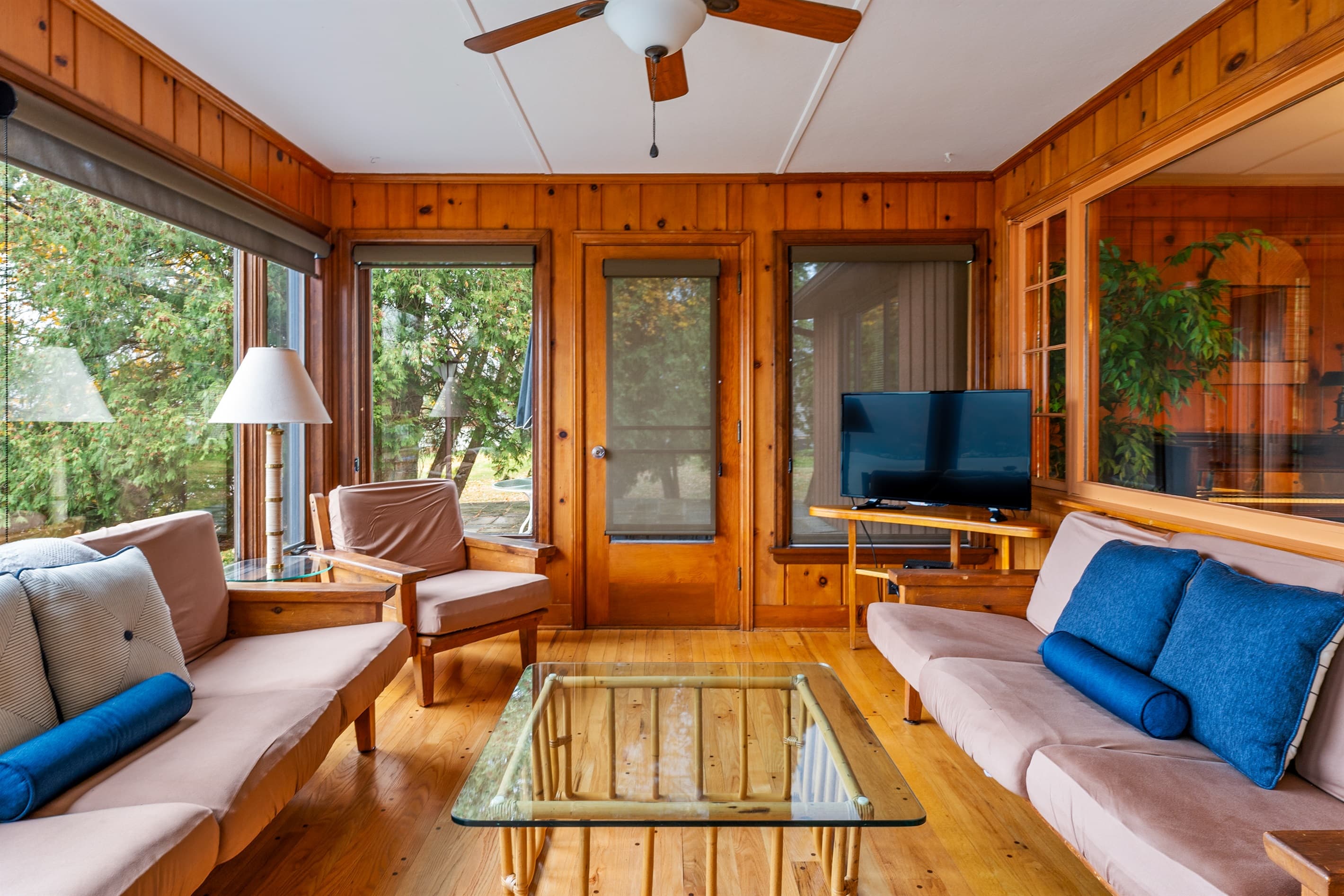 Sunroom seating with wraparound windows