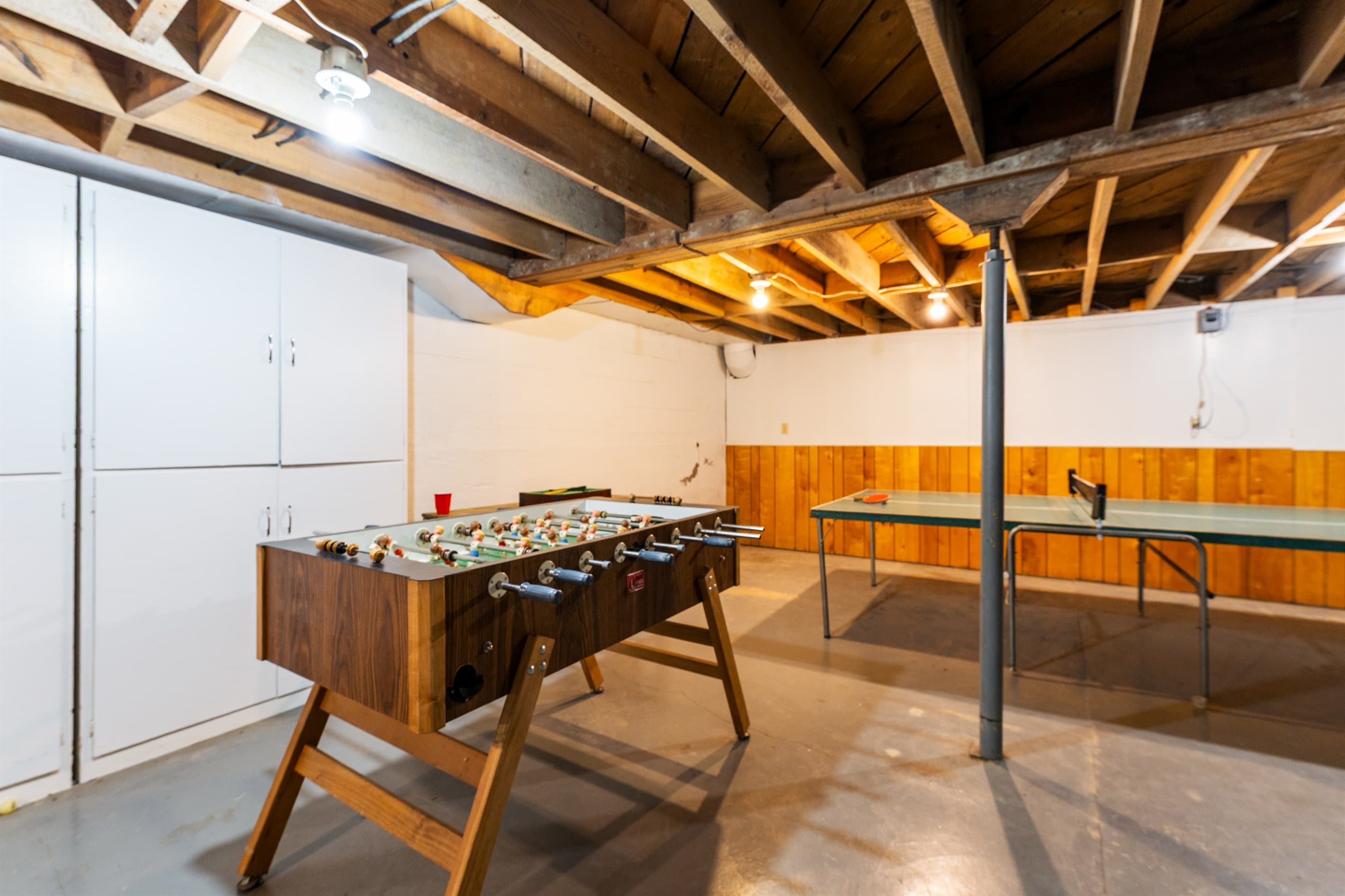 Basement game room in the main house