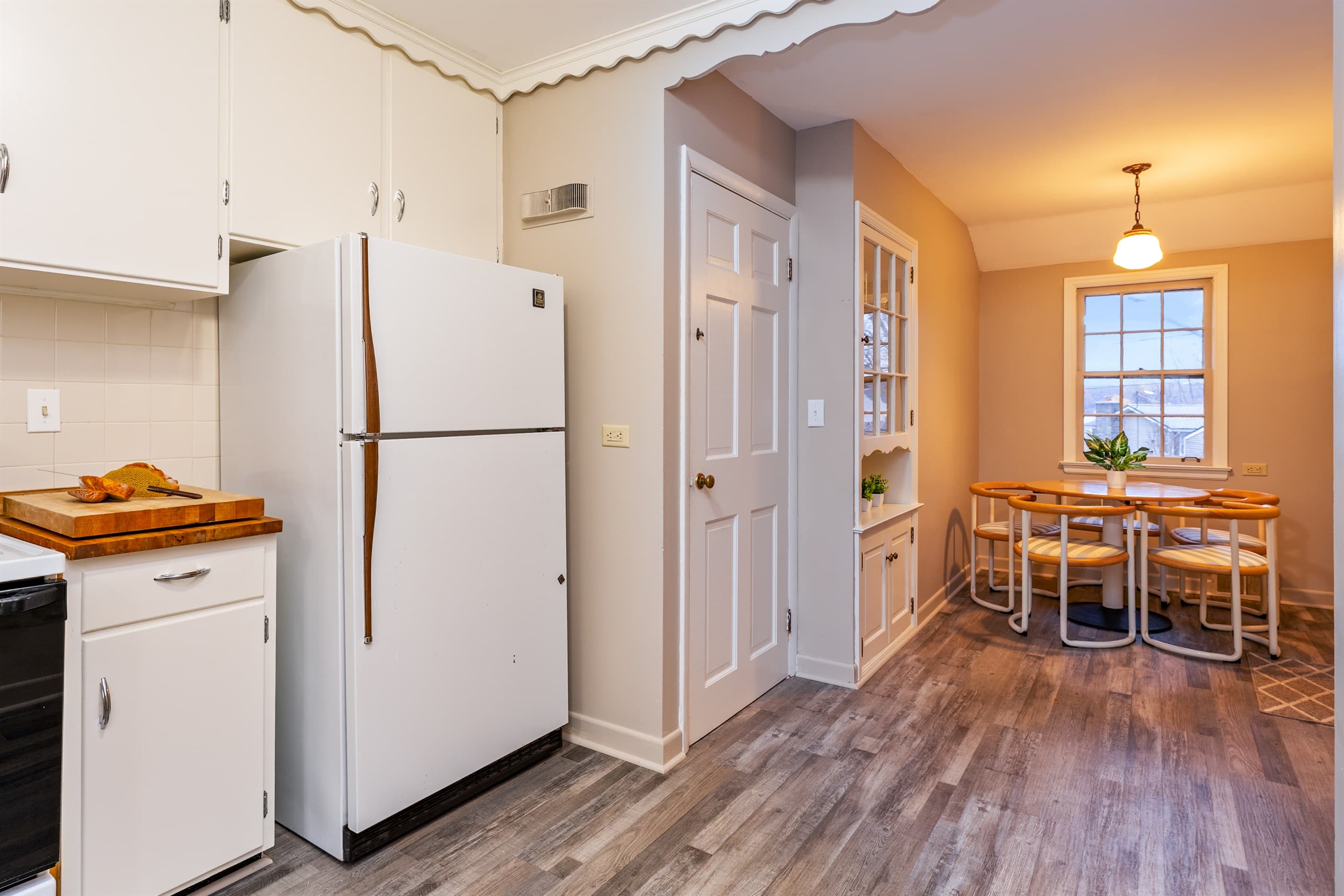 Galley kitchen opening into the dining area