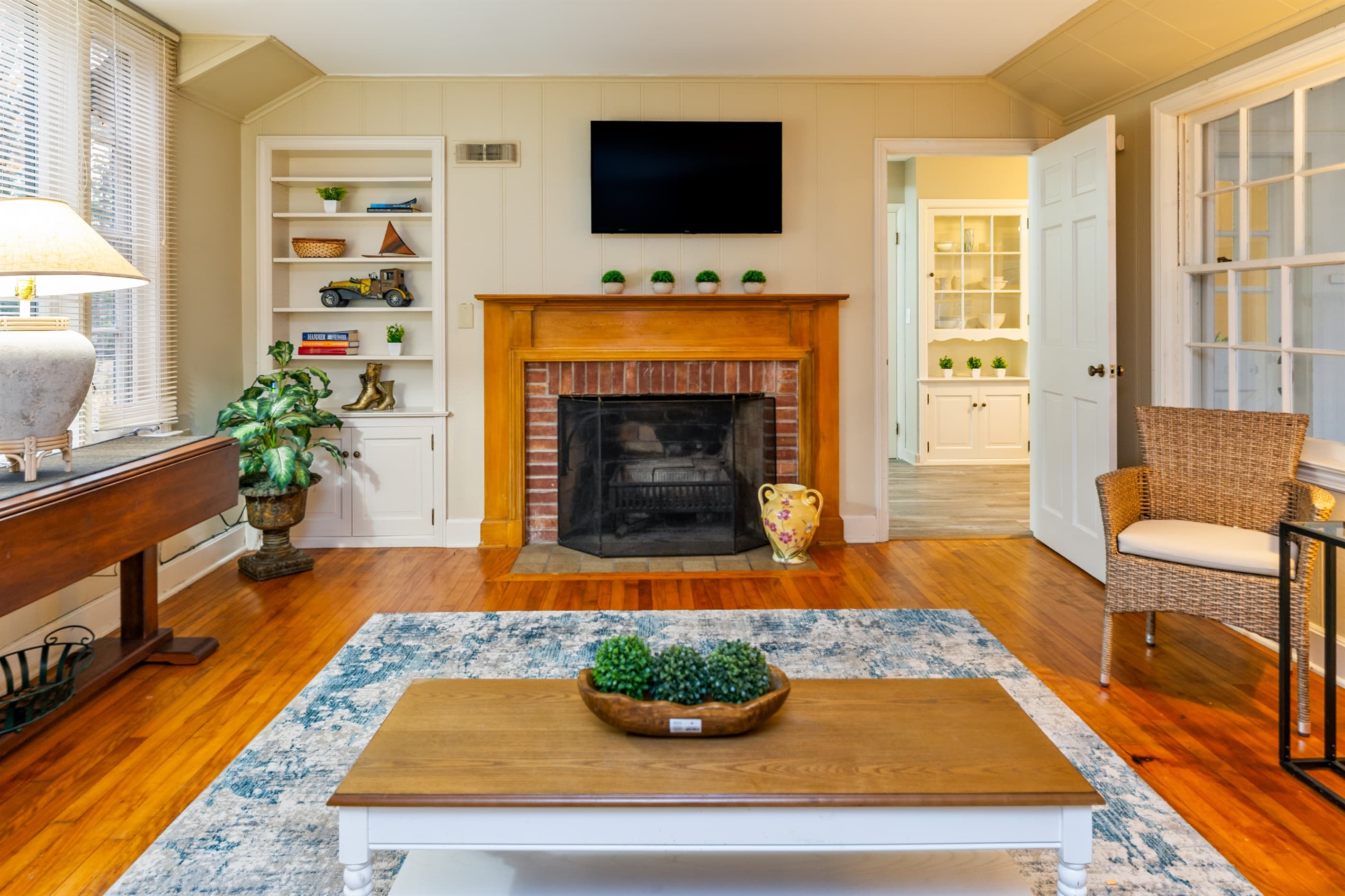 Living room fireplace beneath a mounted television (fireplace is not for guest use)
