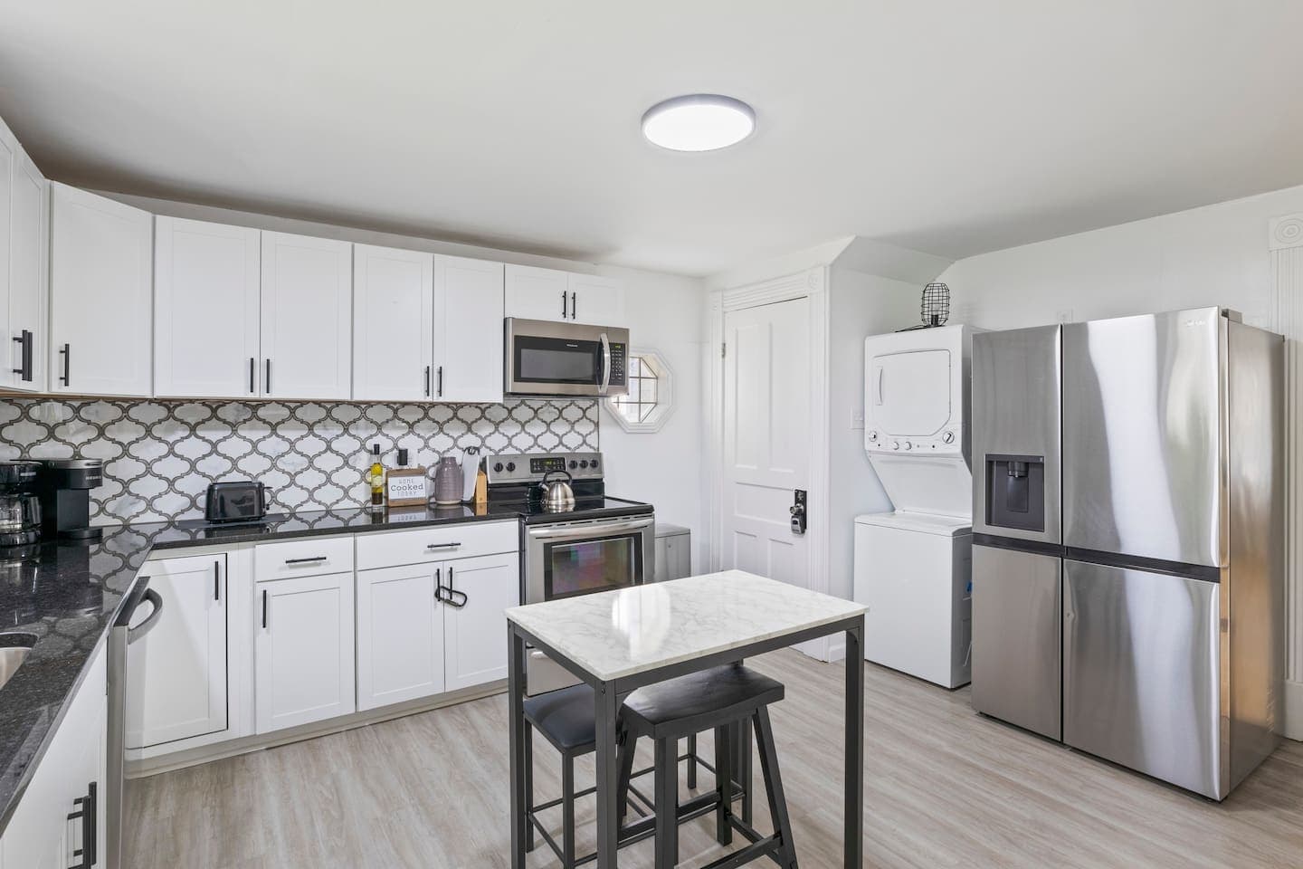 Kitchen with dining nook and stainless appliances