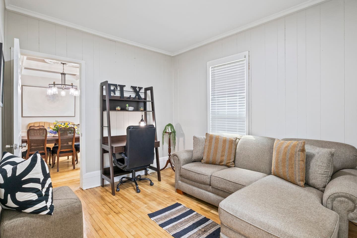 Home office with desk and built-in table shelving