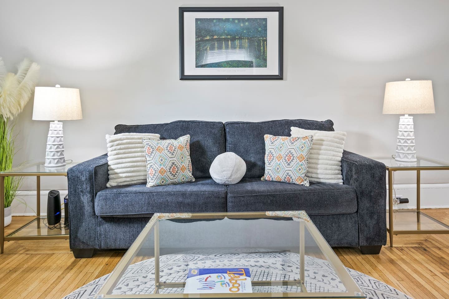 Sofa seating beneath framed artwork