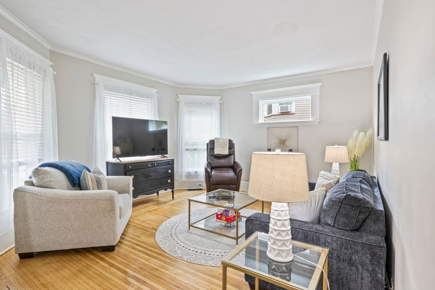 Living room with large windows and accent chairs