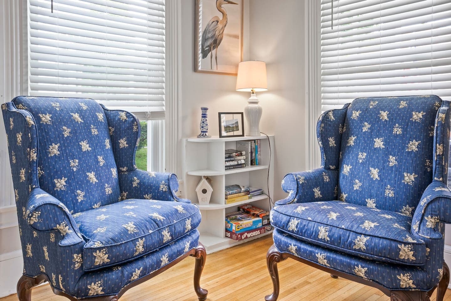 Reading nook with patterned armchairs and lamp