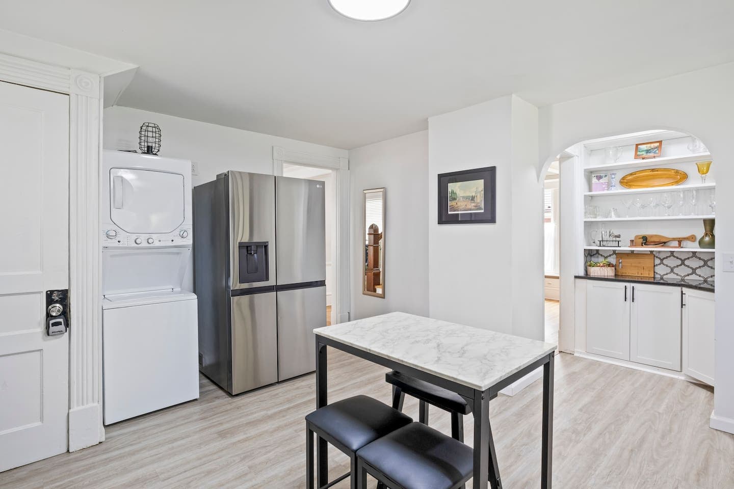 Kitchen with stainless refrigerator and dining nook