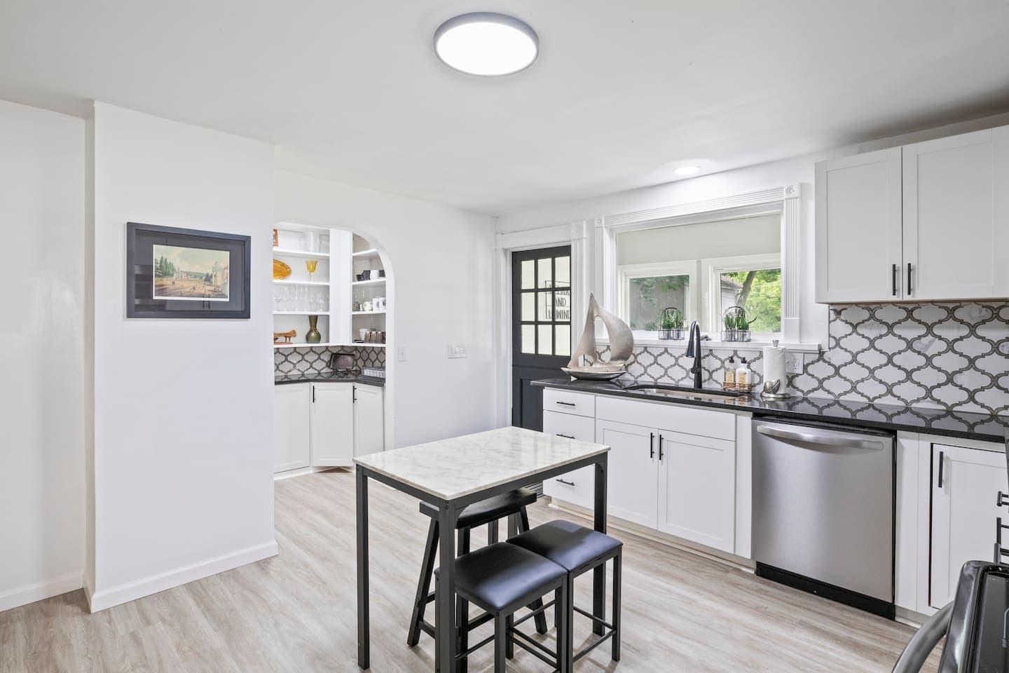 Kitchen island with black bar stools
