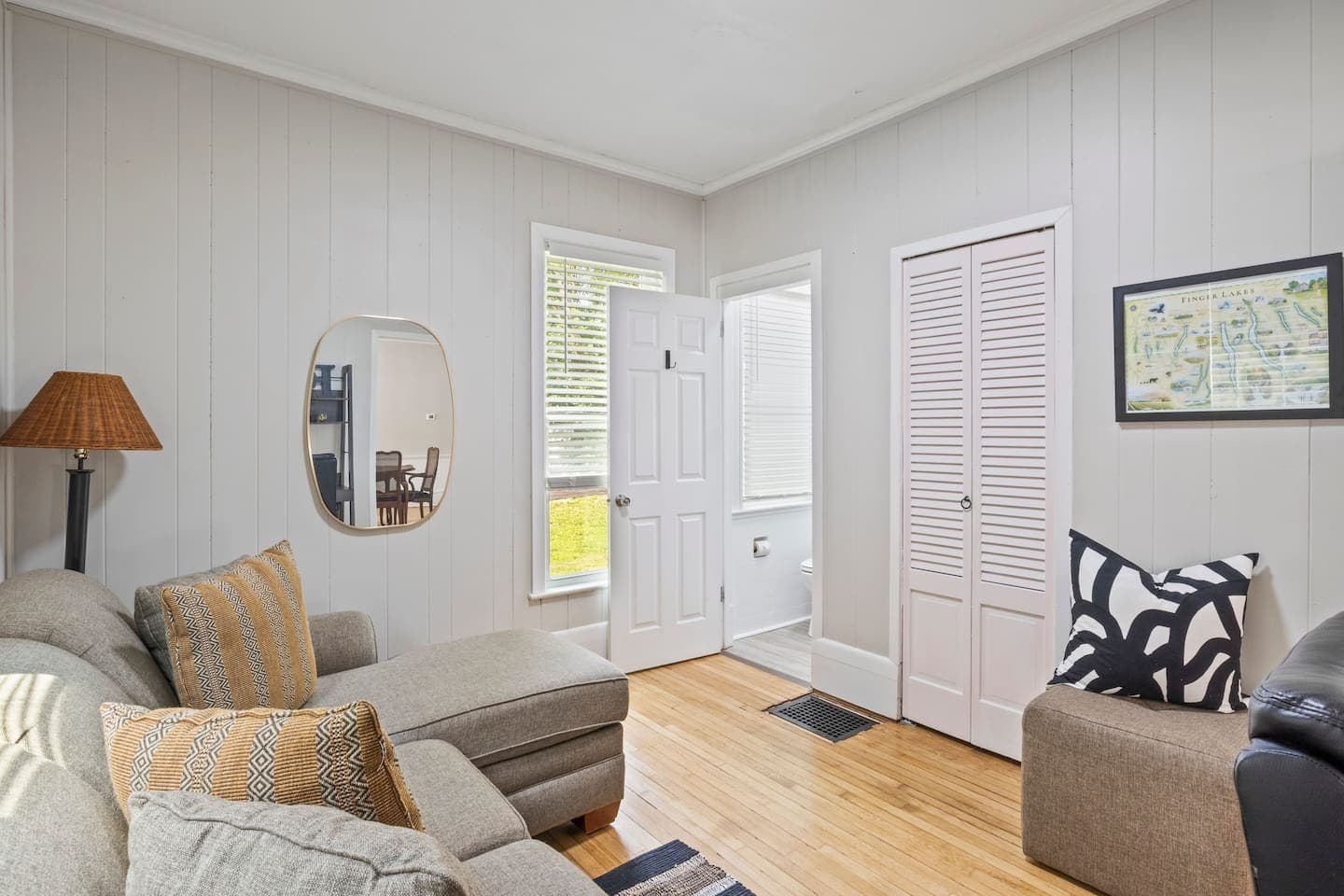 Bright hallway with wood-paneled door