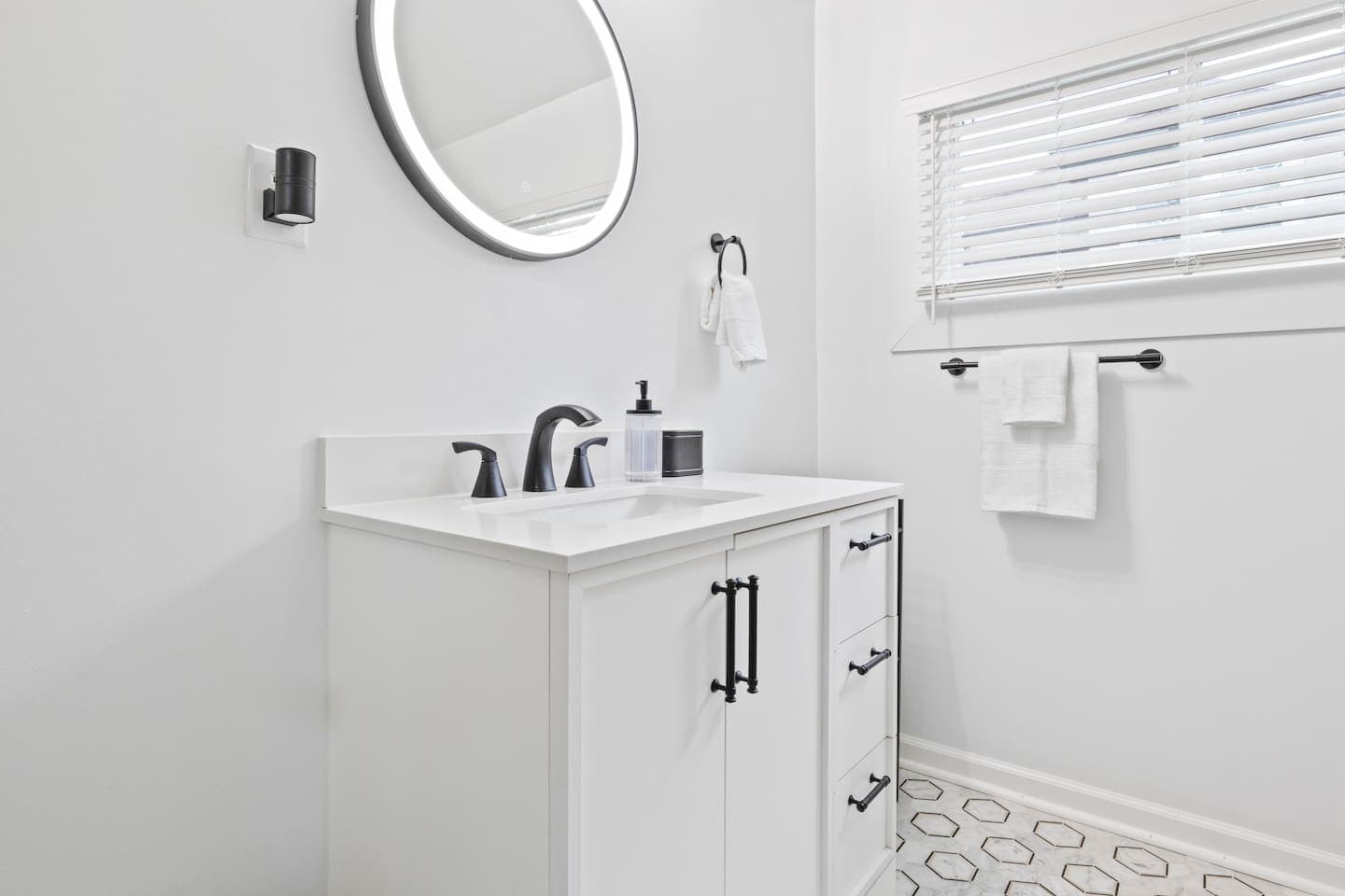 Bathroom vanity with round mirror