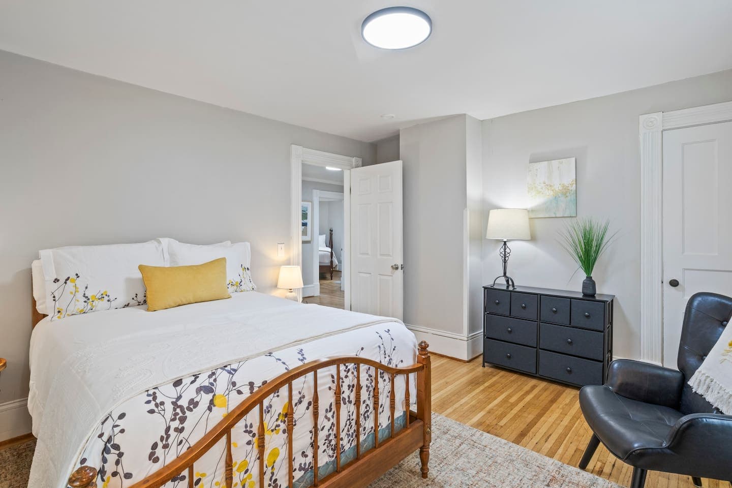 Queen bedroom with wood bed frame