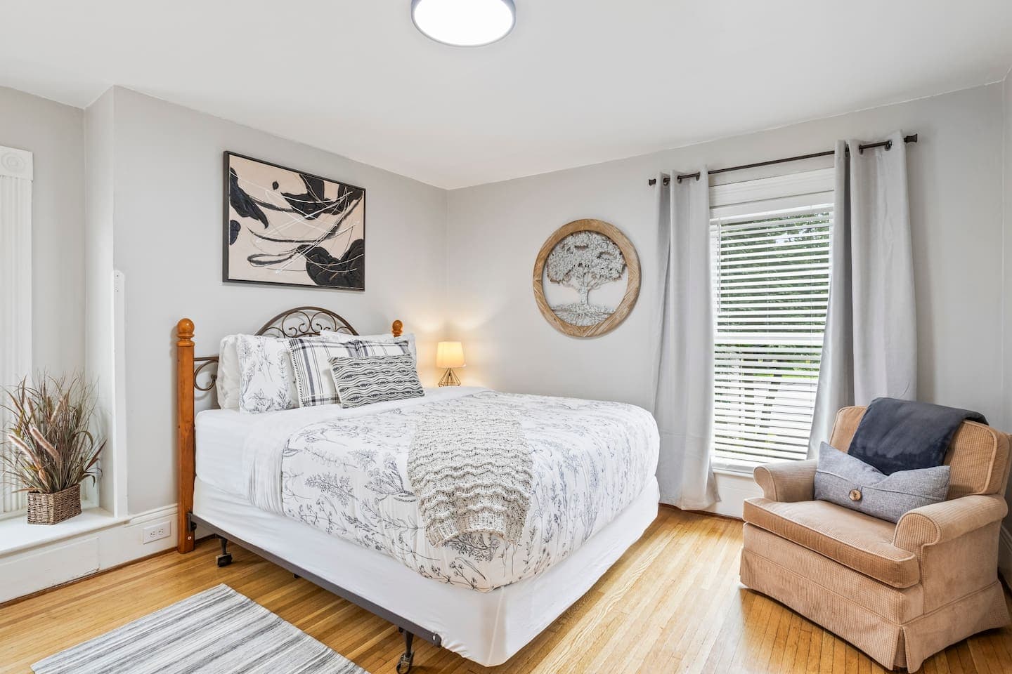 Bedroom with chaise lounge beside the window