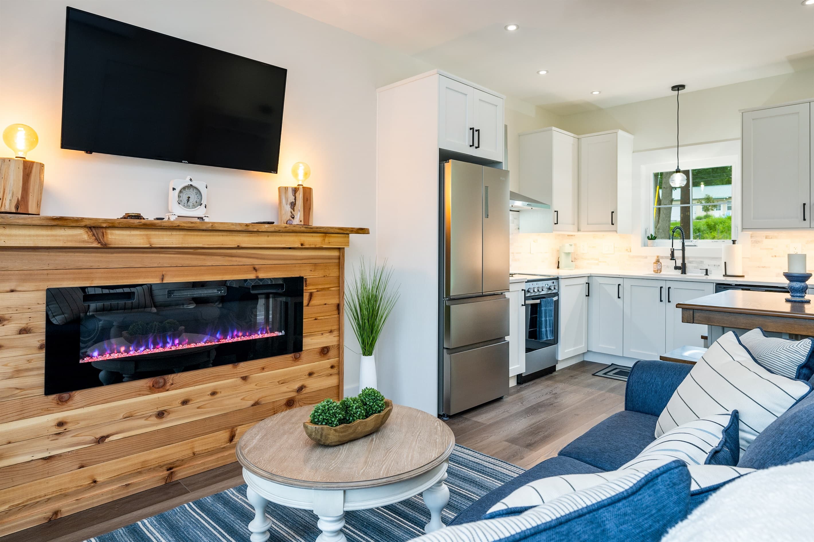 Living area with electric fireplace and television
