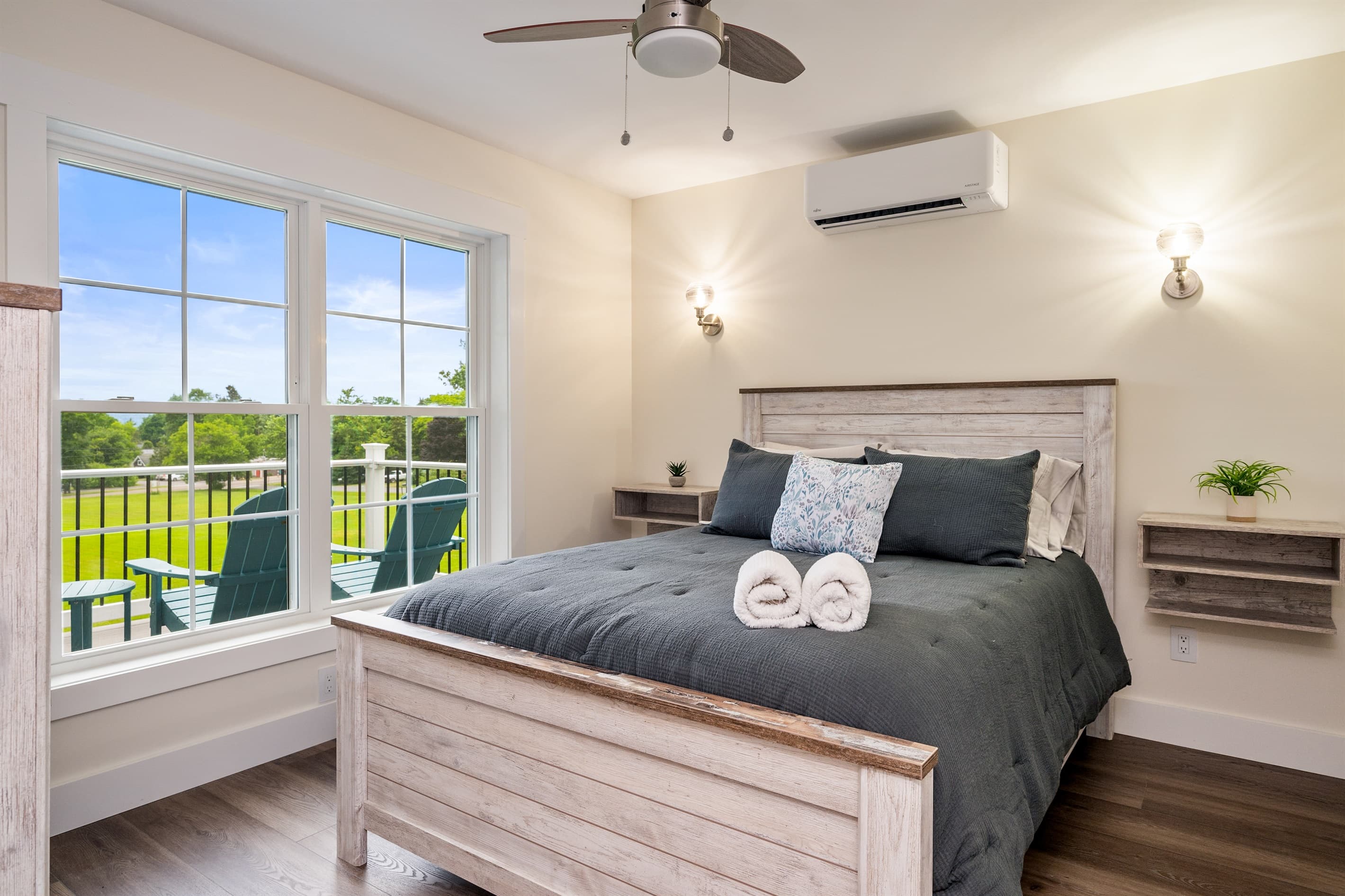 Bedroom with wide windows and countryside views
