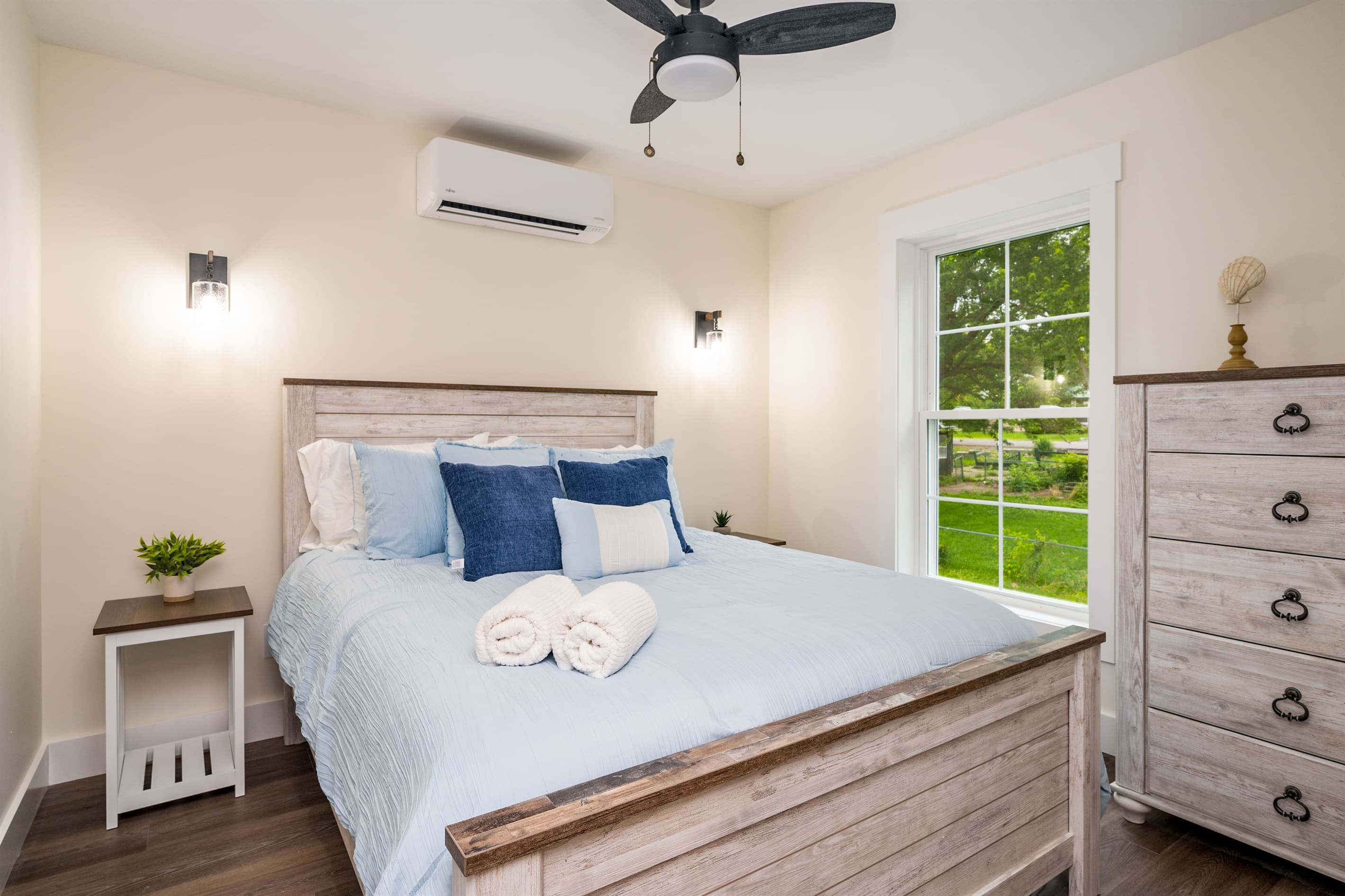 Bedroom with dresser and ceiling fan