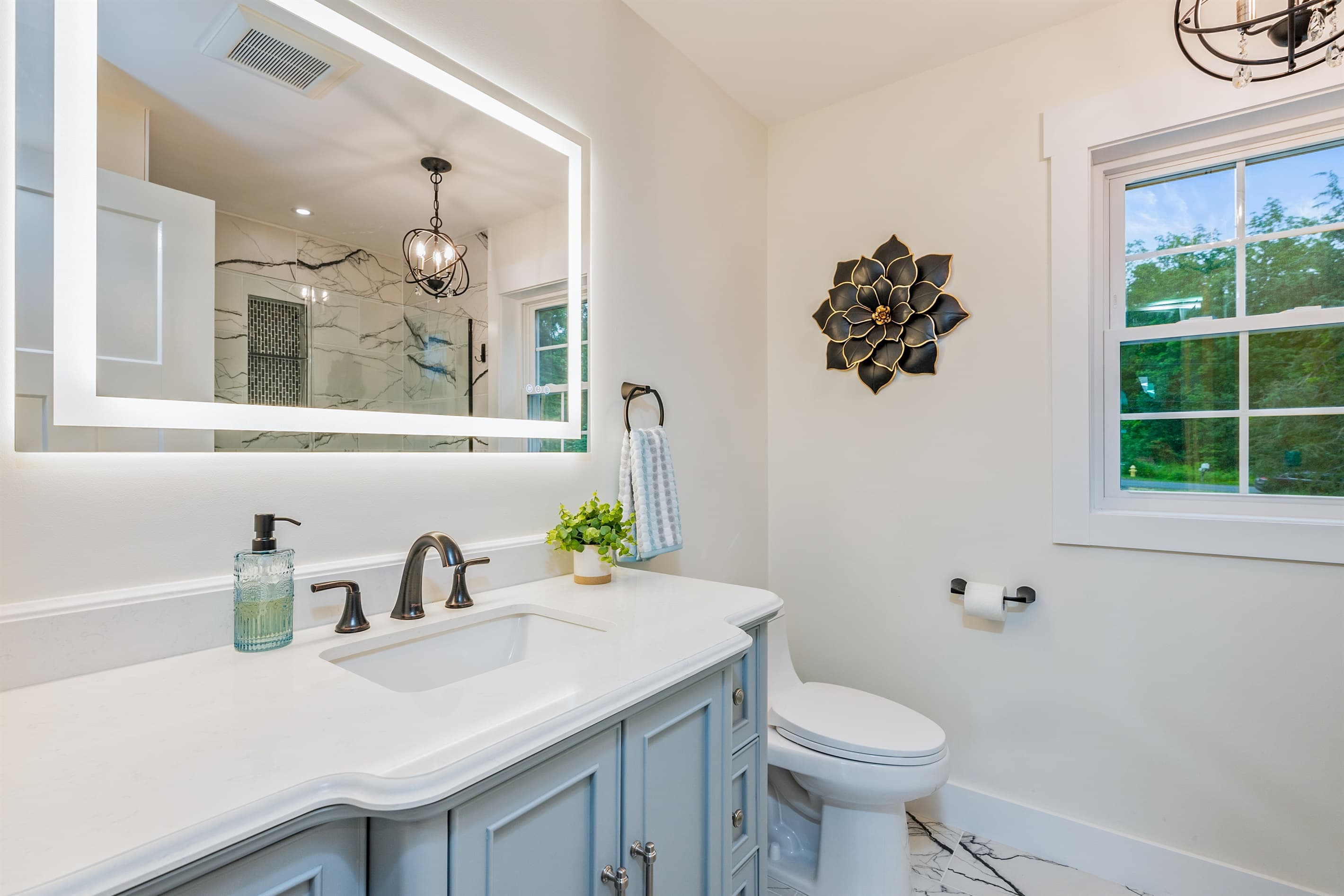 Bathroom vanity with illuminated mirror