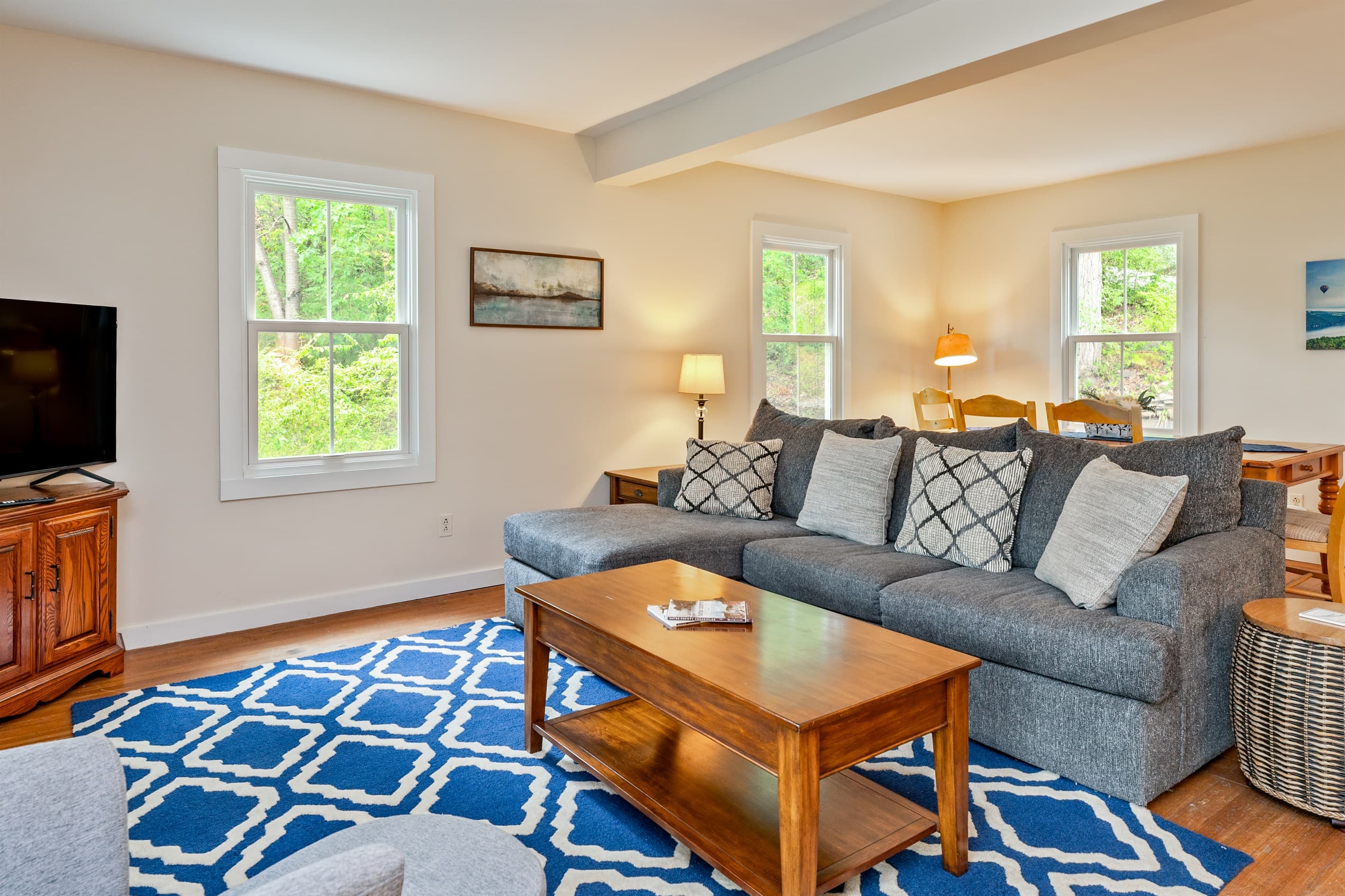 Living room with sectional and wooden coffee table
