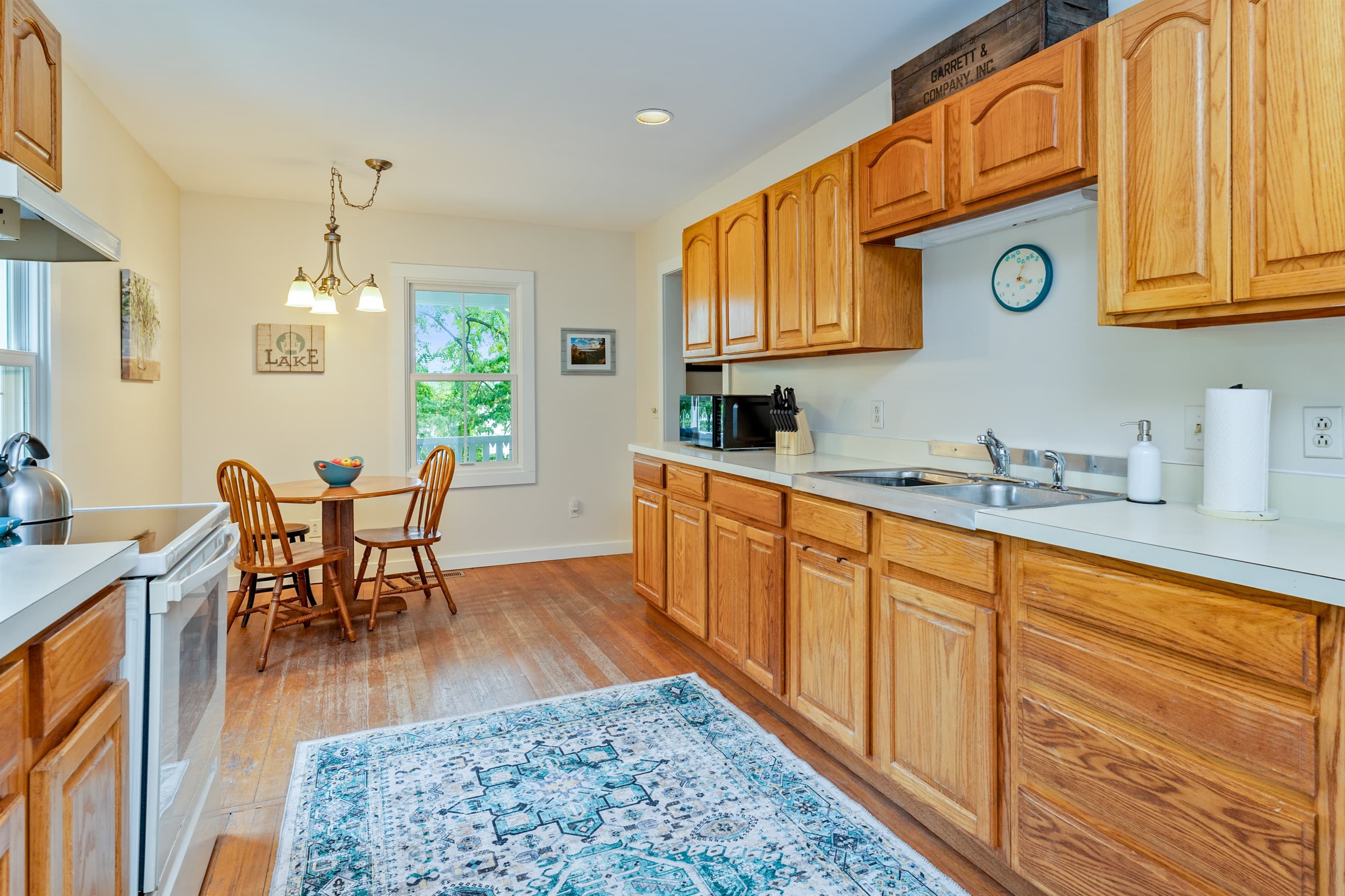 Kitchen with wood cabinetry and dining table