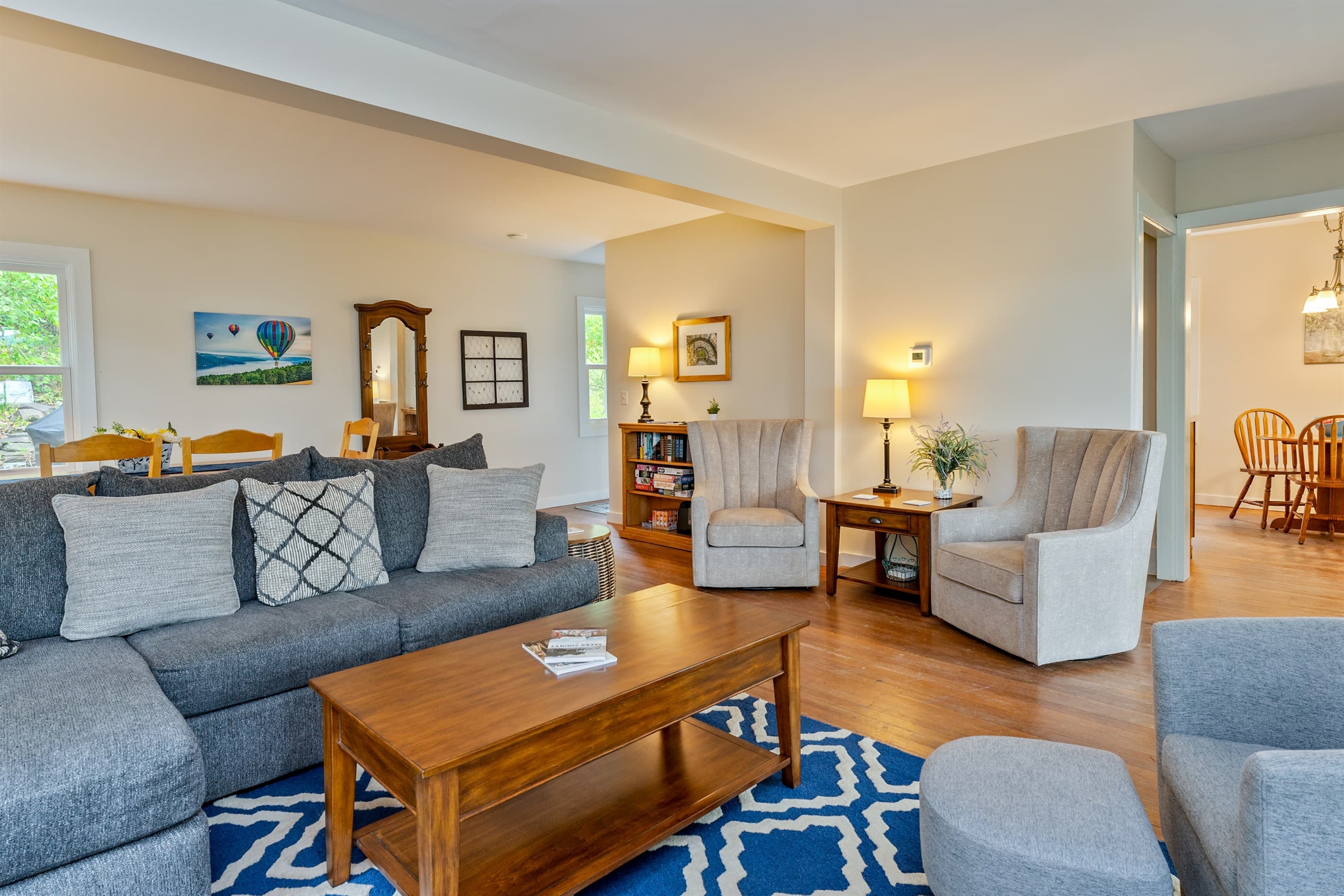 Open kitchen and living area with grey sofa
