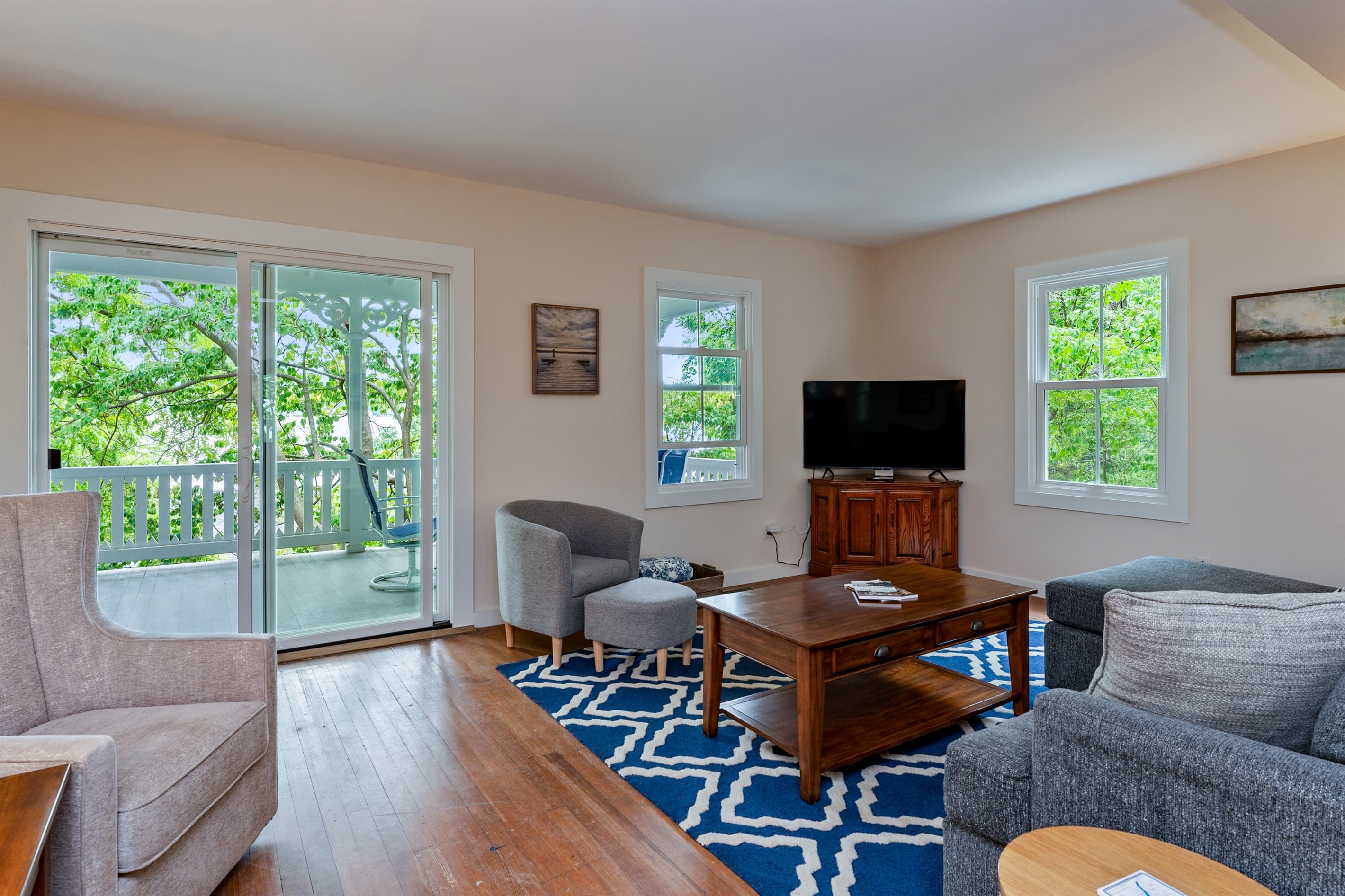 Living room with grey sofa and wooden furnishings