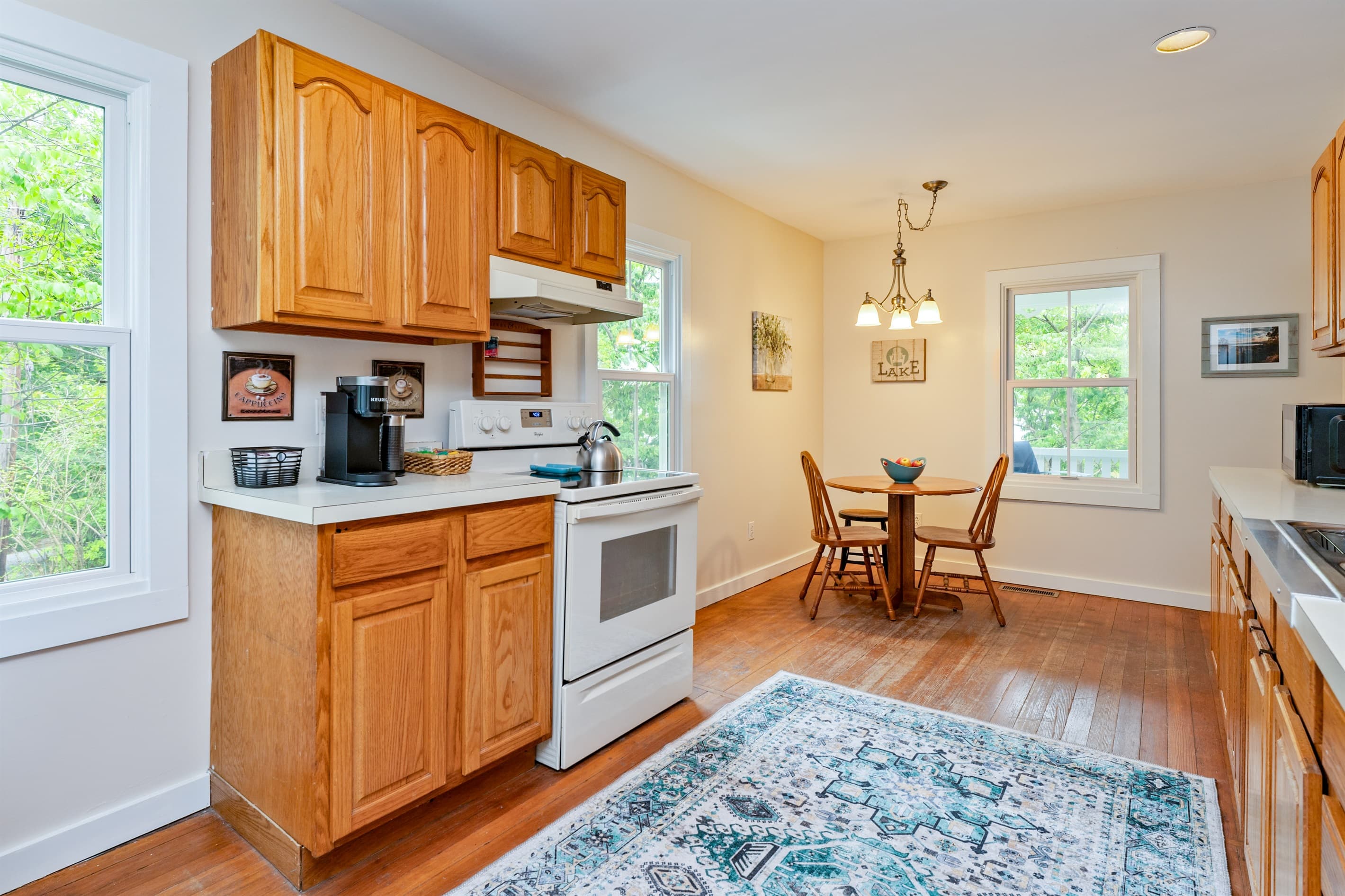 Kitchen and dining area with hardwood floors