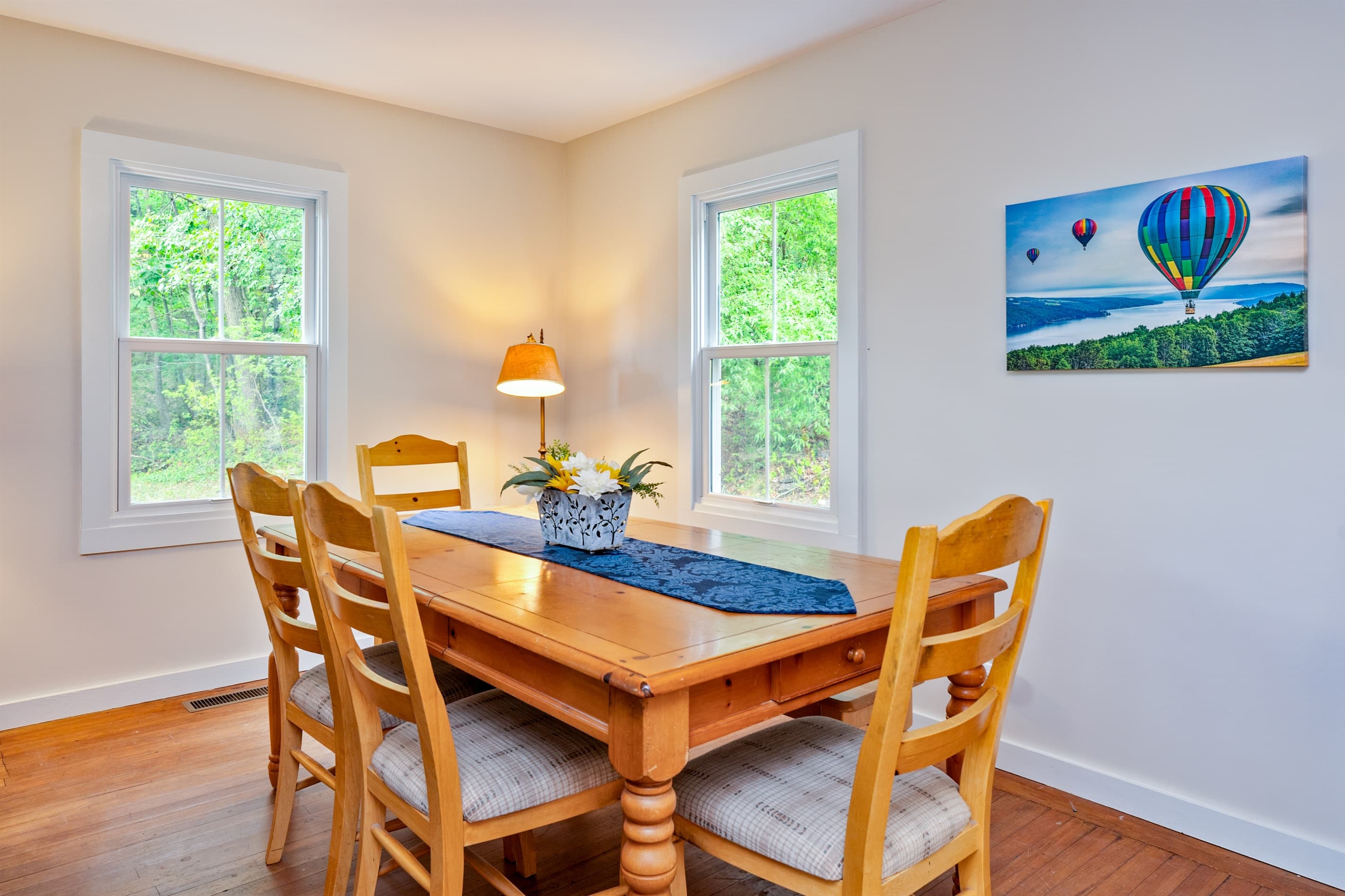 Wood dining table surrounded by natural light