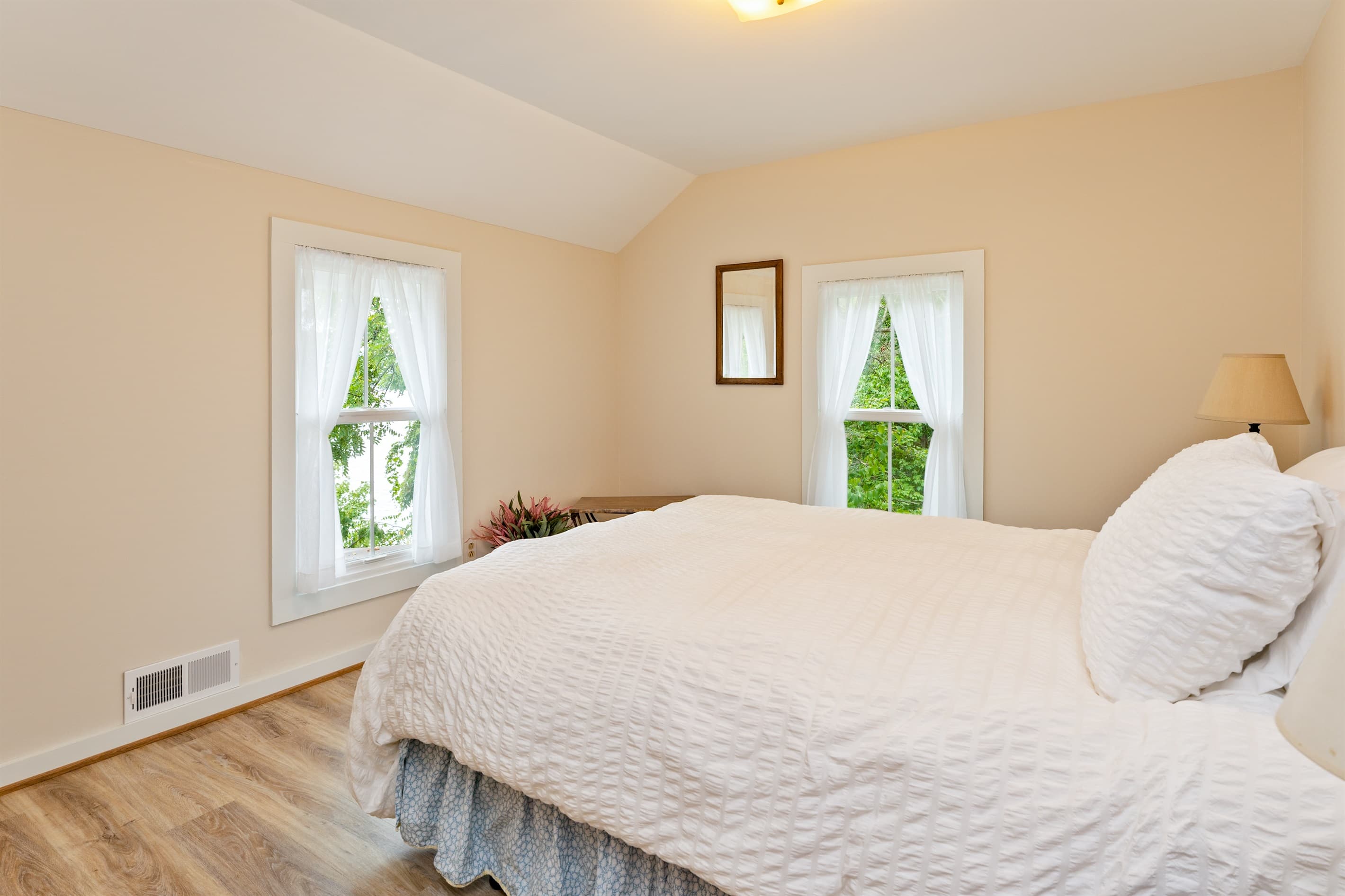 Bedroom with multiple windows 
