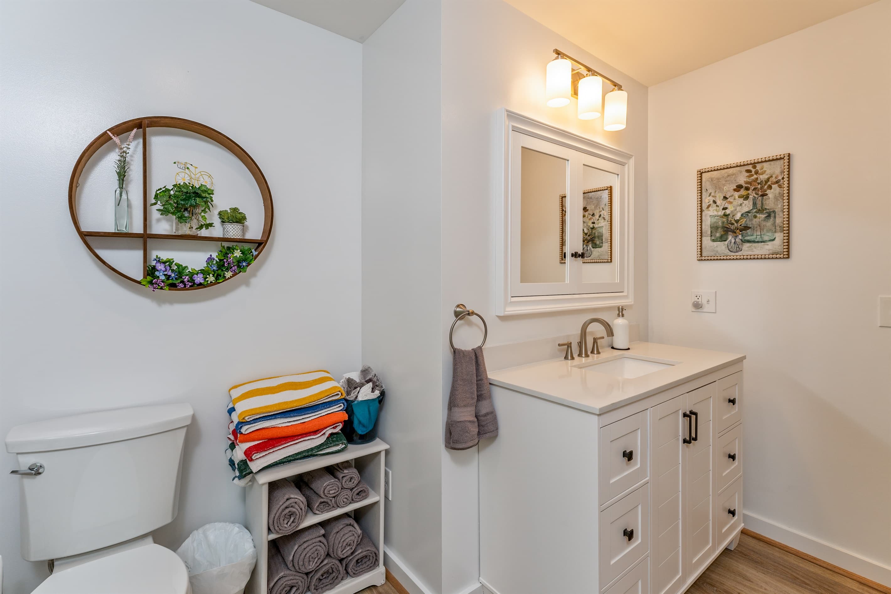 Bathroom vanity with toilet and towel storage