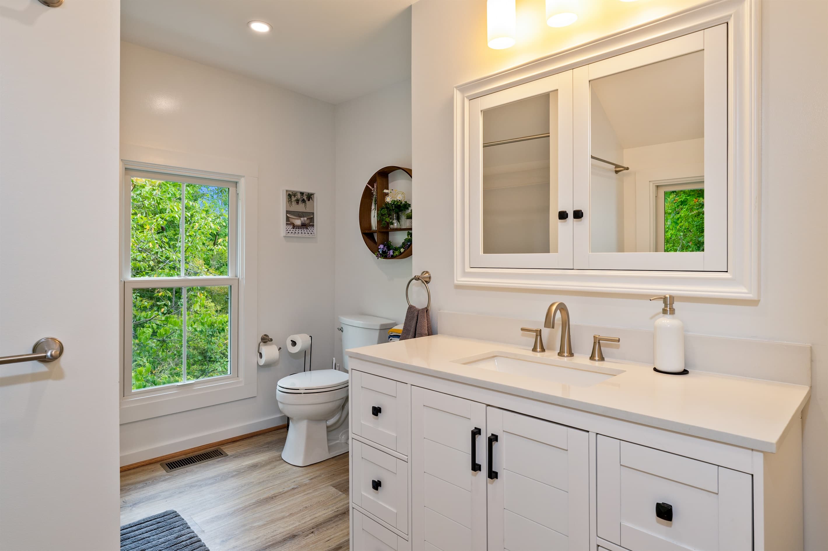 Bathroom with toilet and white furnishings