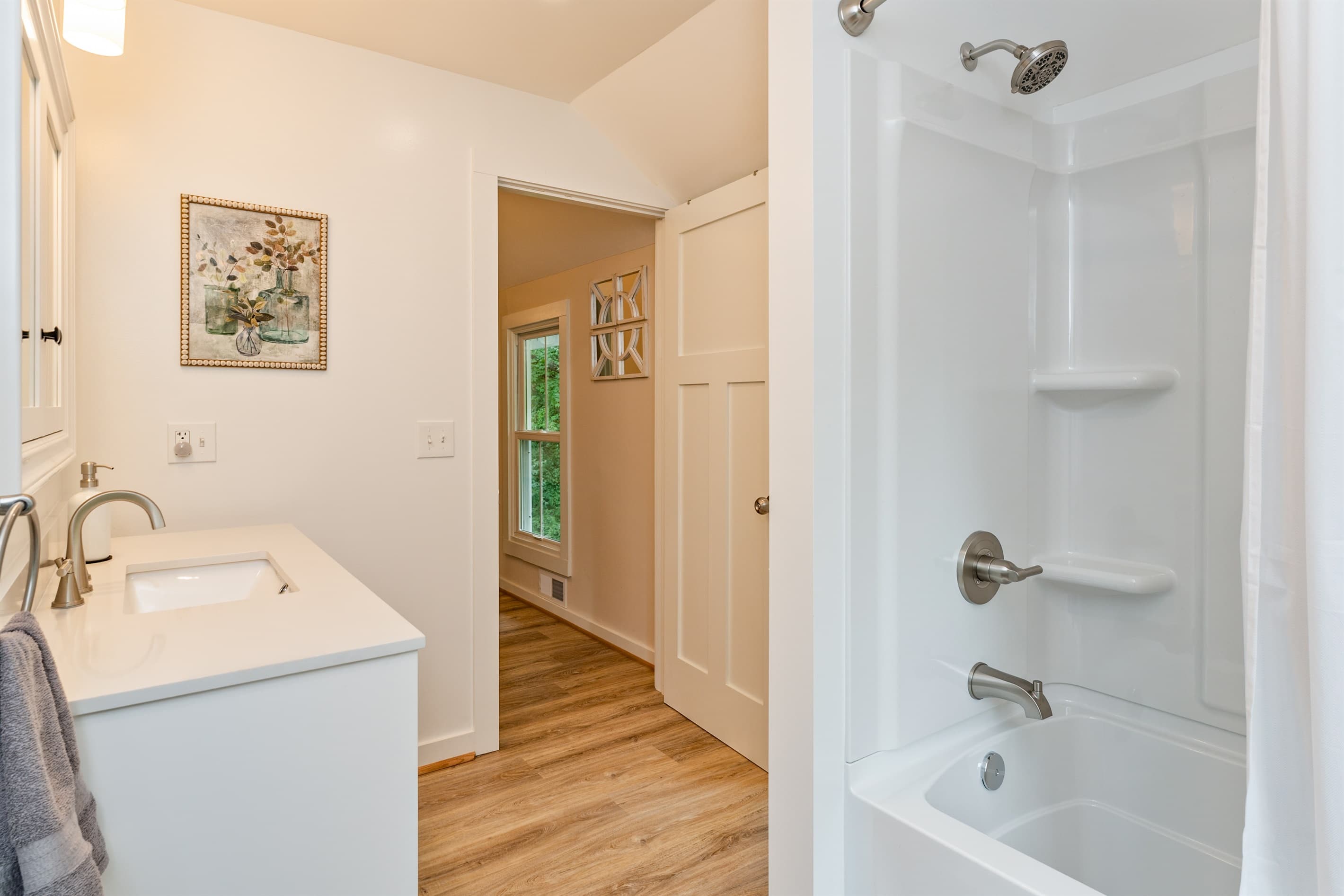 Full bathroom with combined tub and shower
