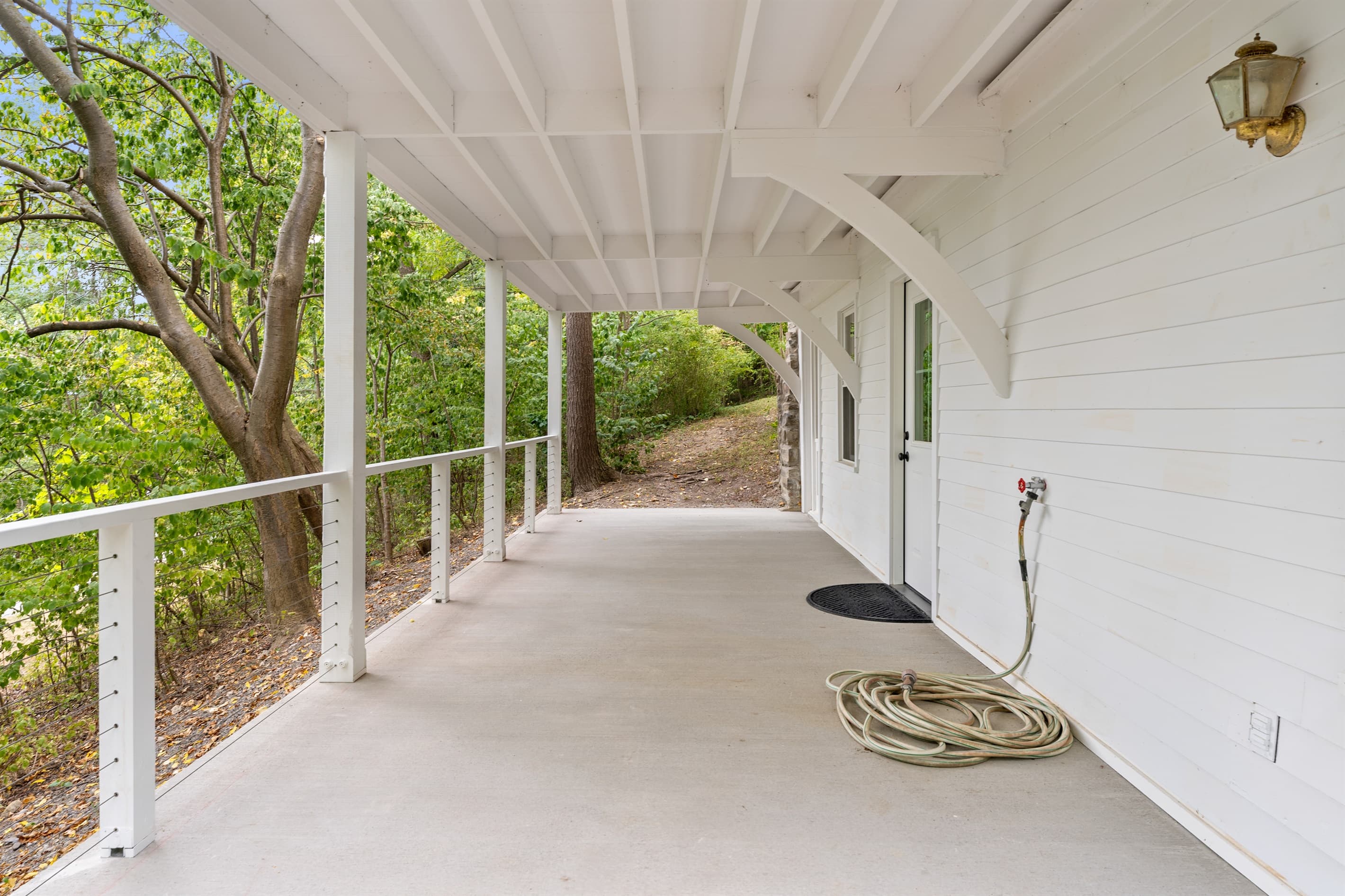 Spacious covered porch with open floor space