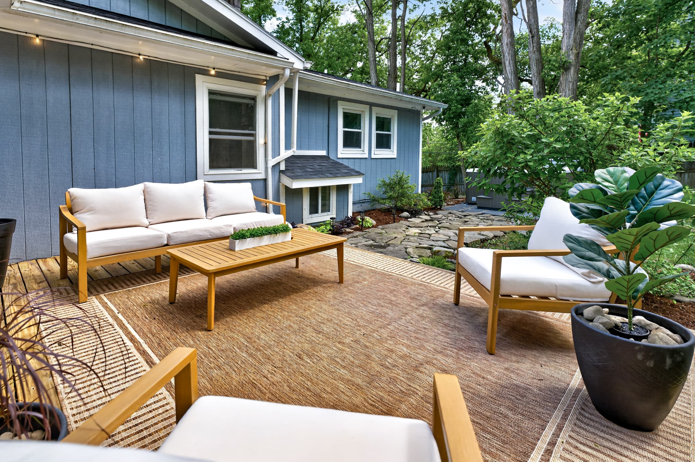 Outdoor lounge seating beside the blue exterior