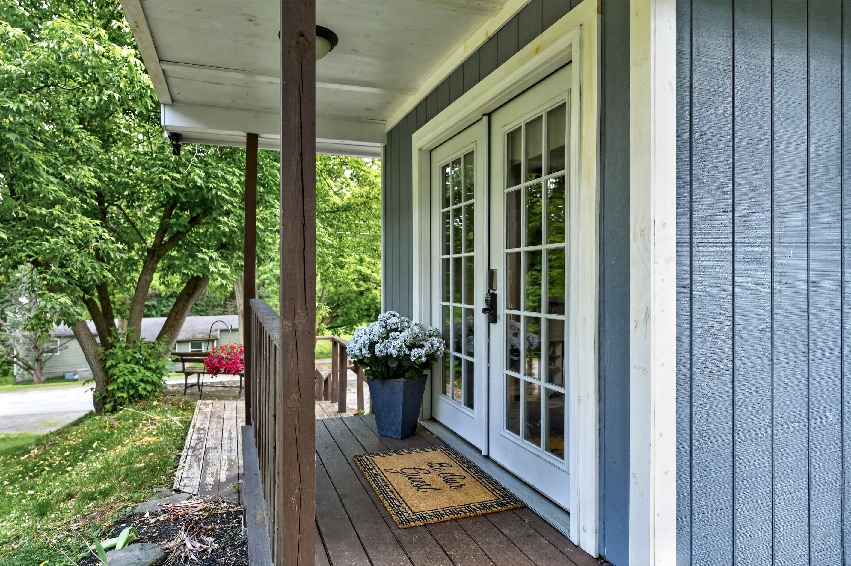 Covered porch with French doors and planters
