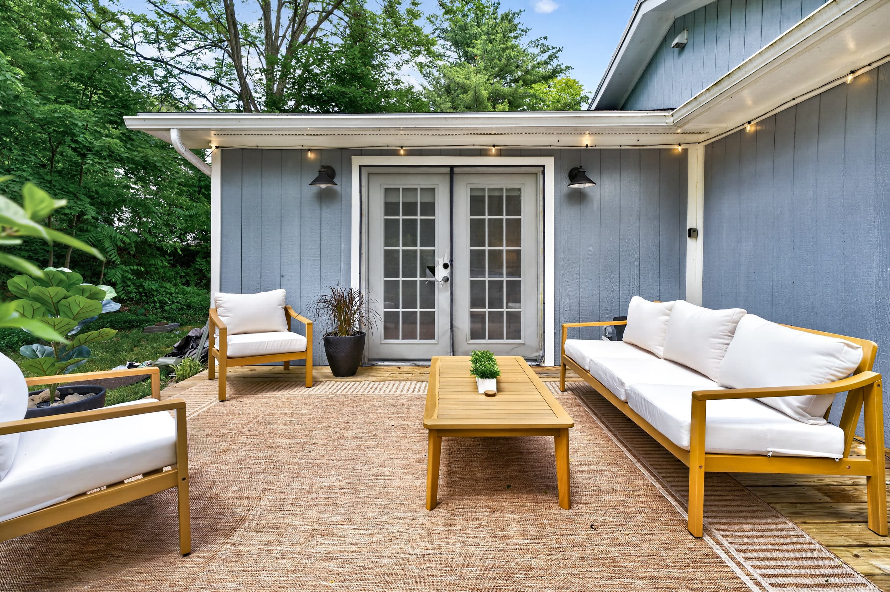 Outdoor sofa facing the French doors