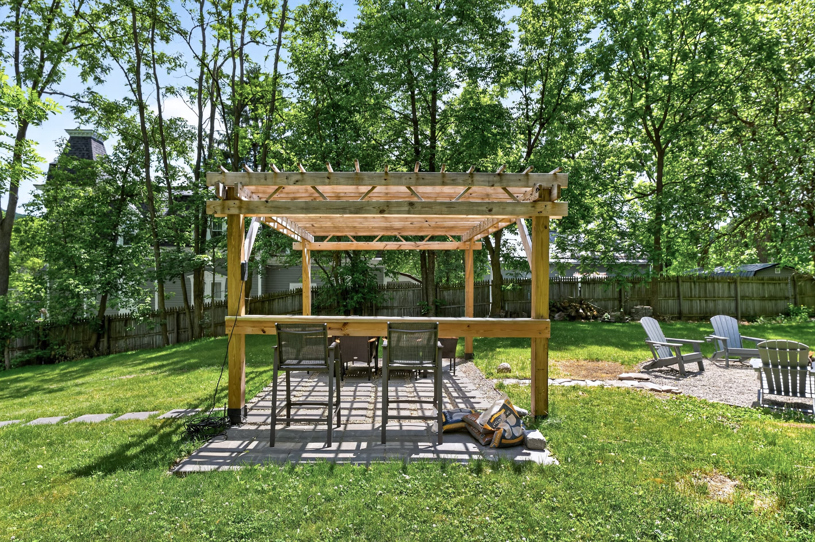 Pergola and nearby fire pit seating