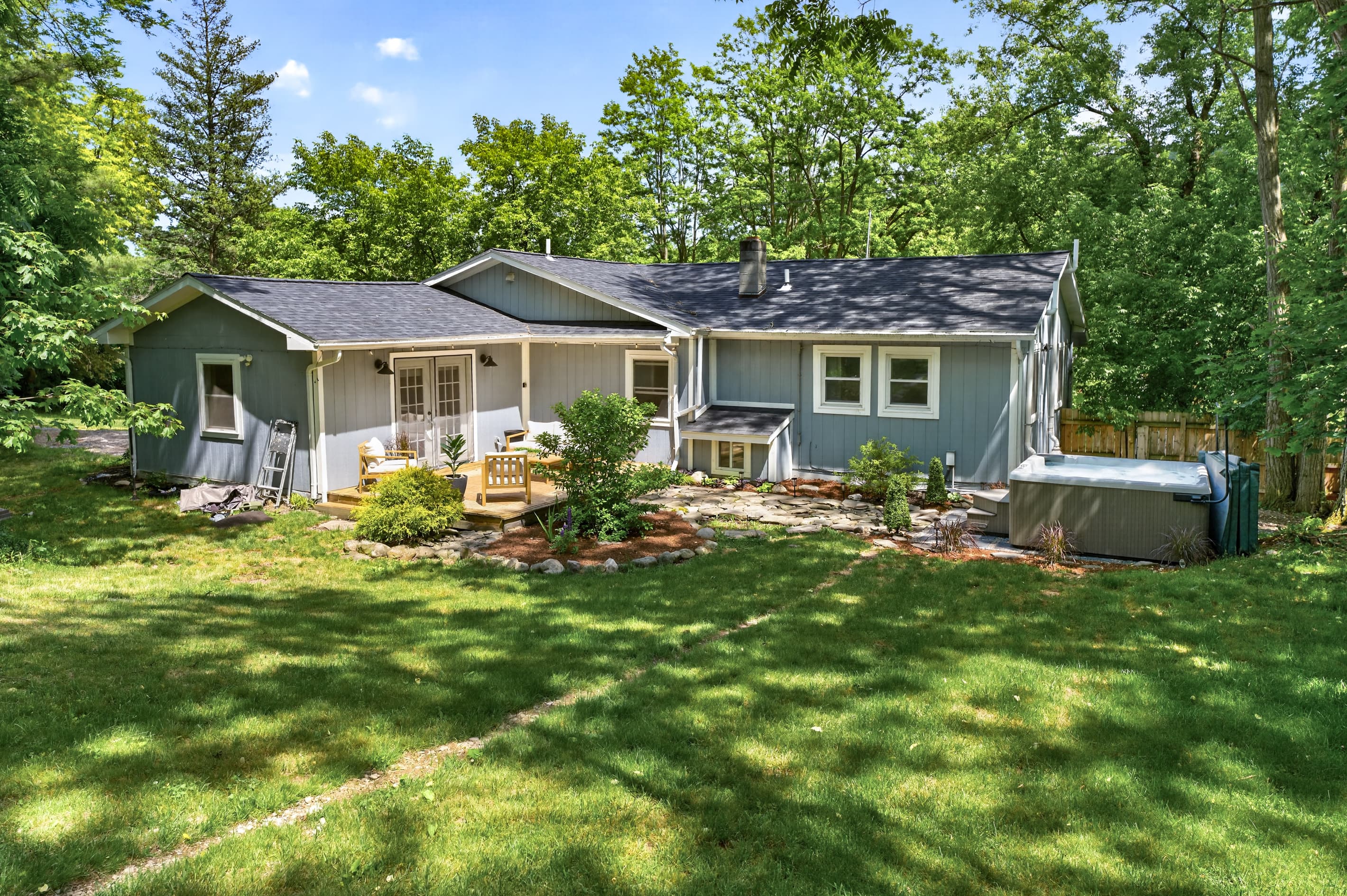 Rear exterior with patio and hot tub