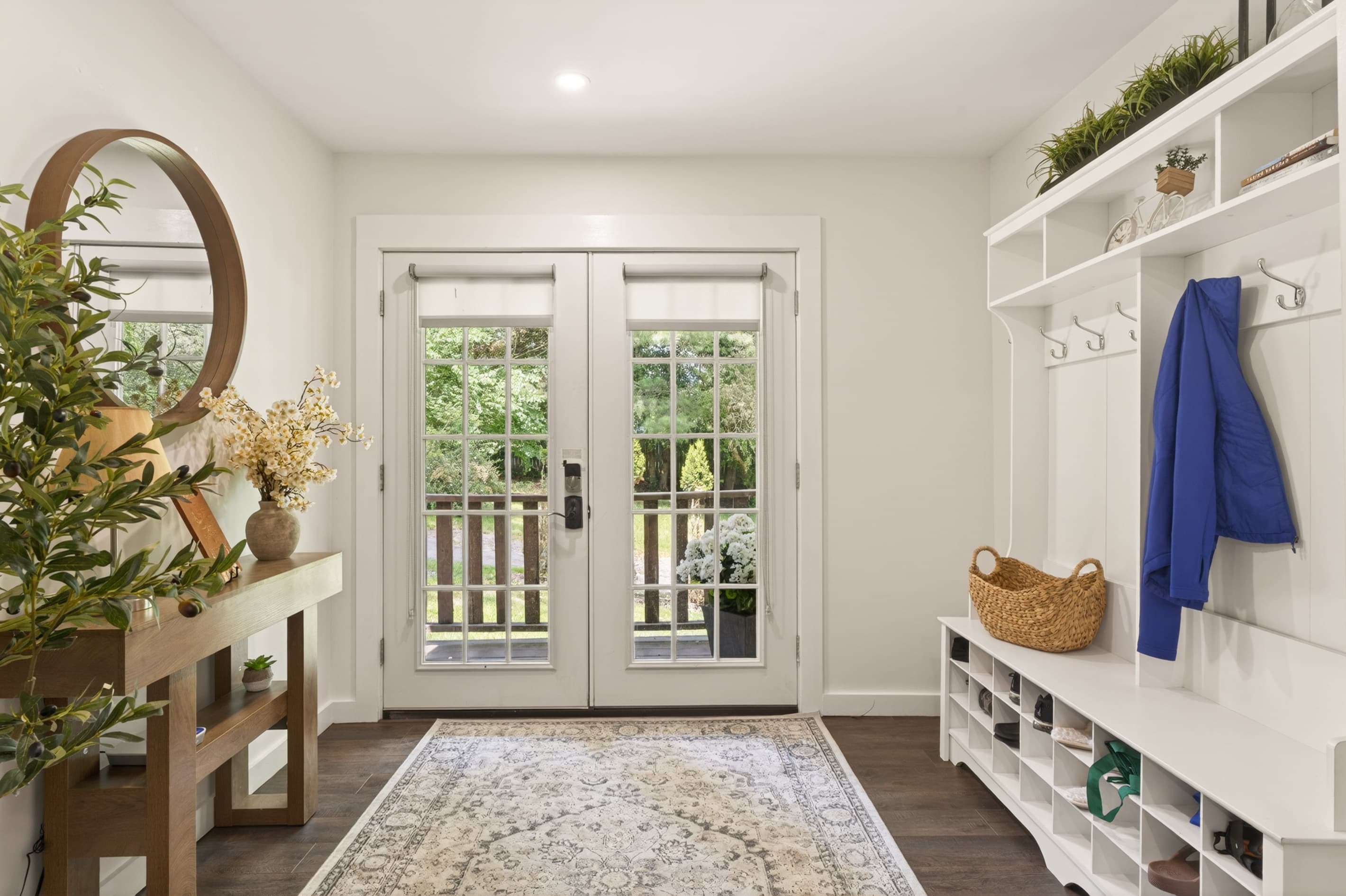 Entry area with French doors and storage bench