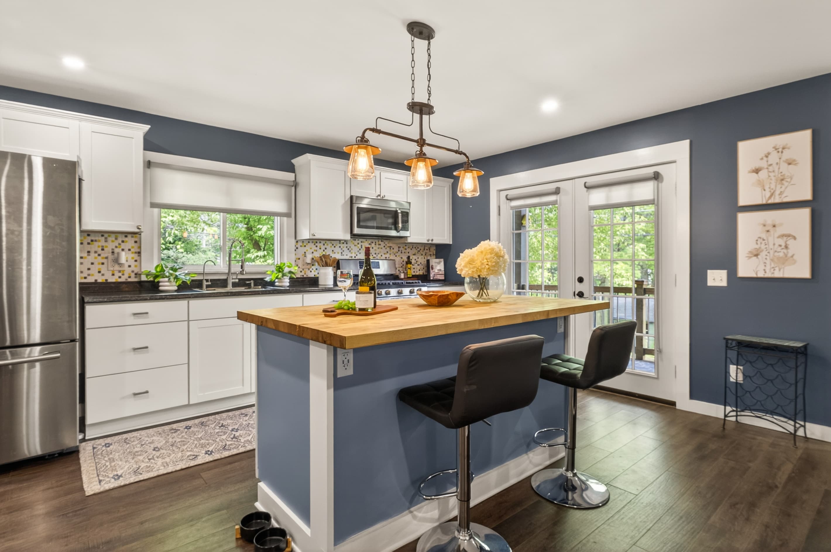 Kitchen with island and glass patio doors