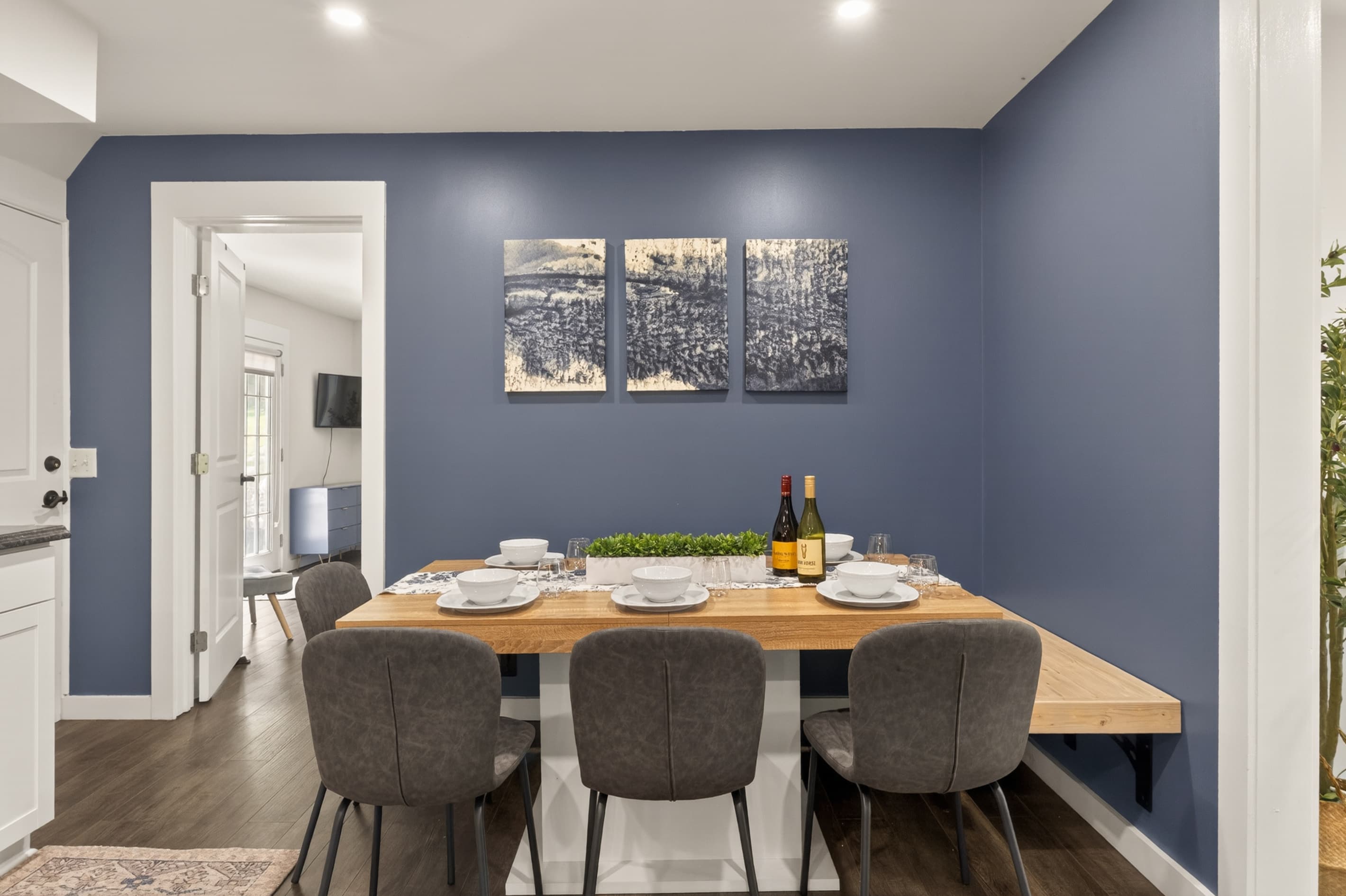 Dining table against navy accent wall