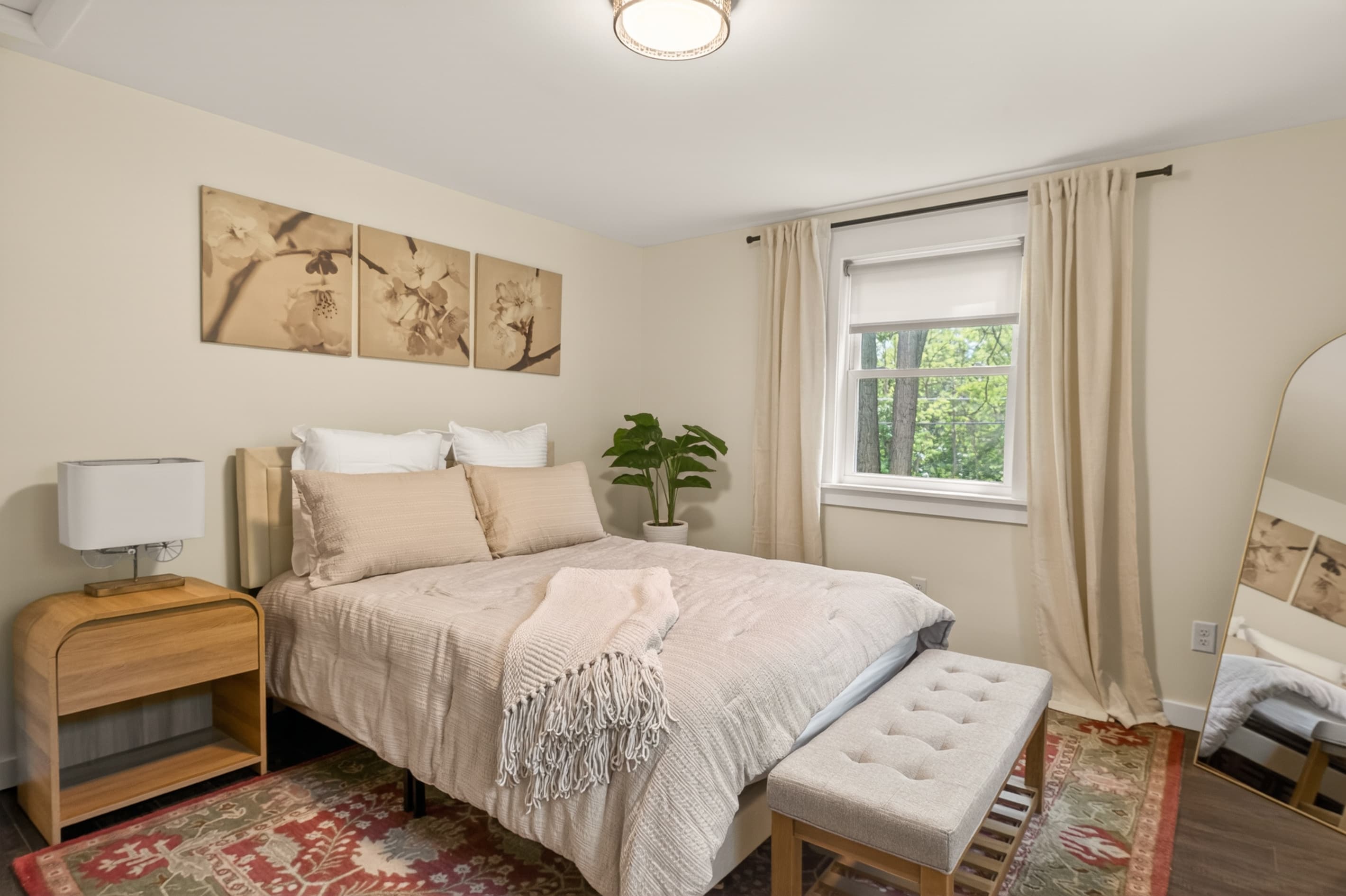 Bedroom with bench at foot of bed