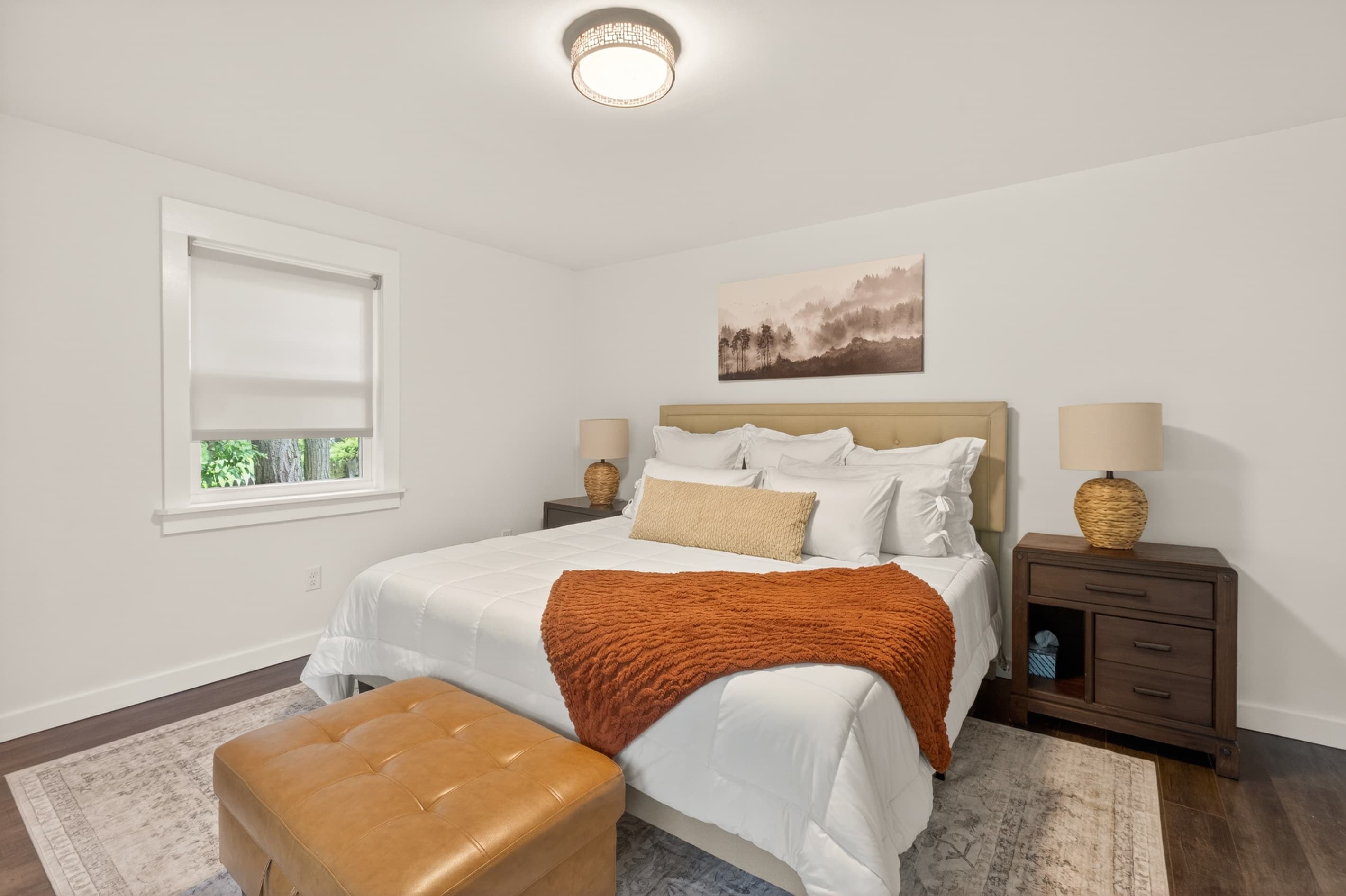 Bedroom with bench and two nightstands