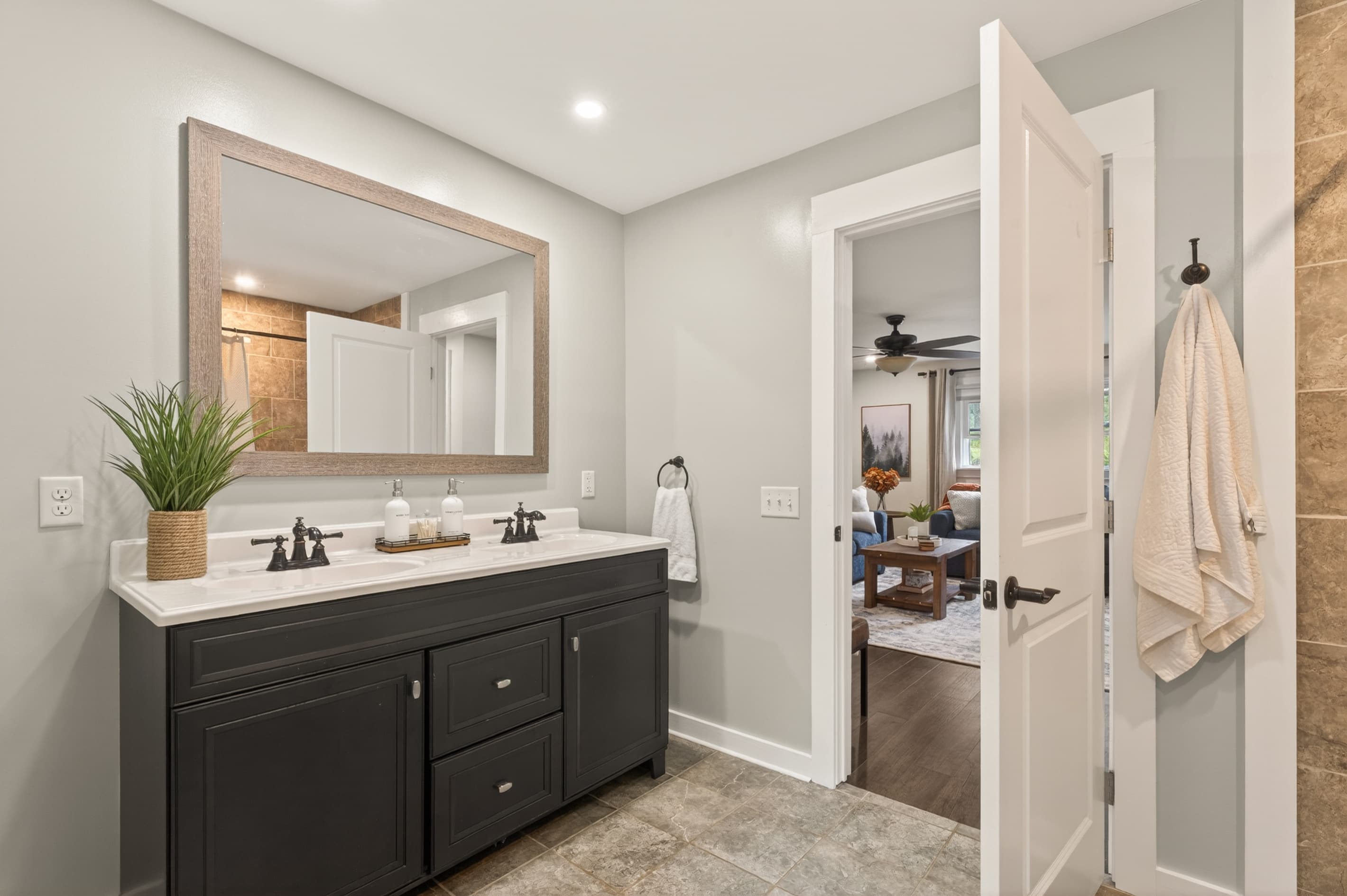 Bathroom with double vanity and glass shower