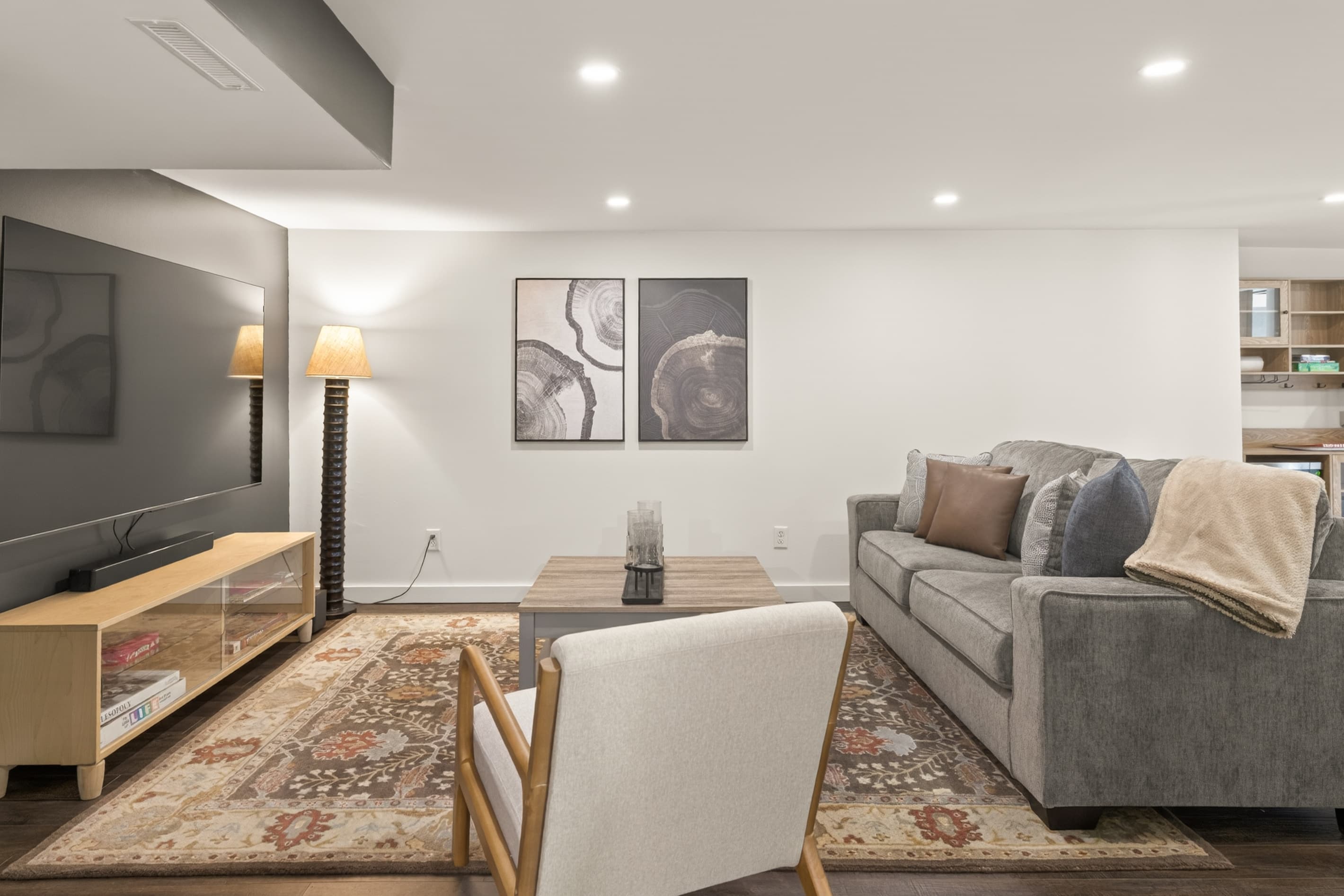 Sofa facing large wall-mounted television