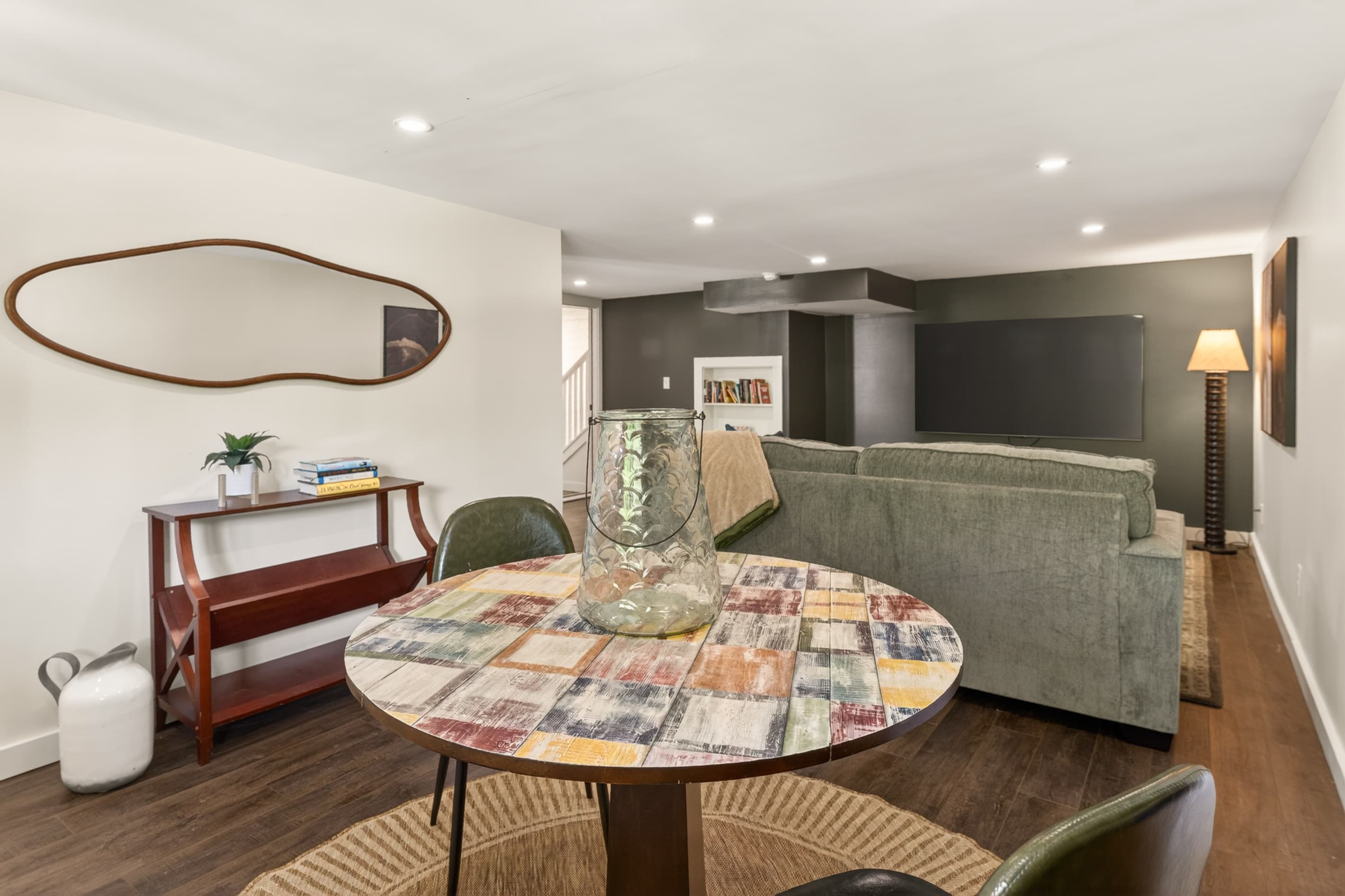 Round dining table beside lower living area