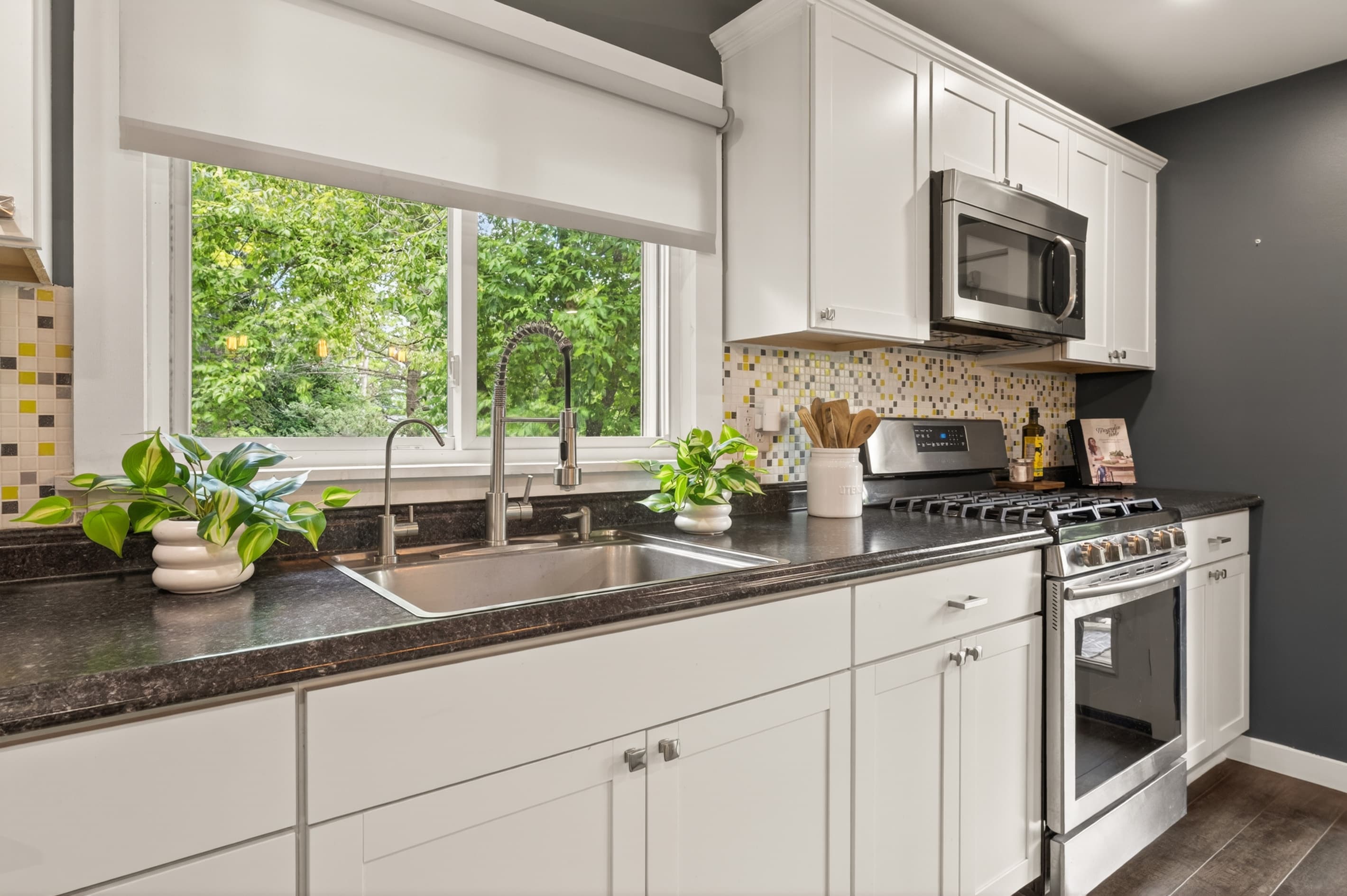 Kitchenette with sink, range, and microwave