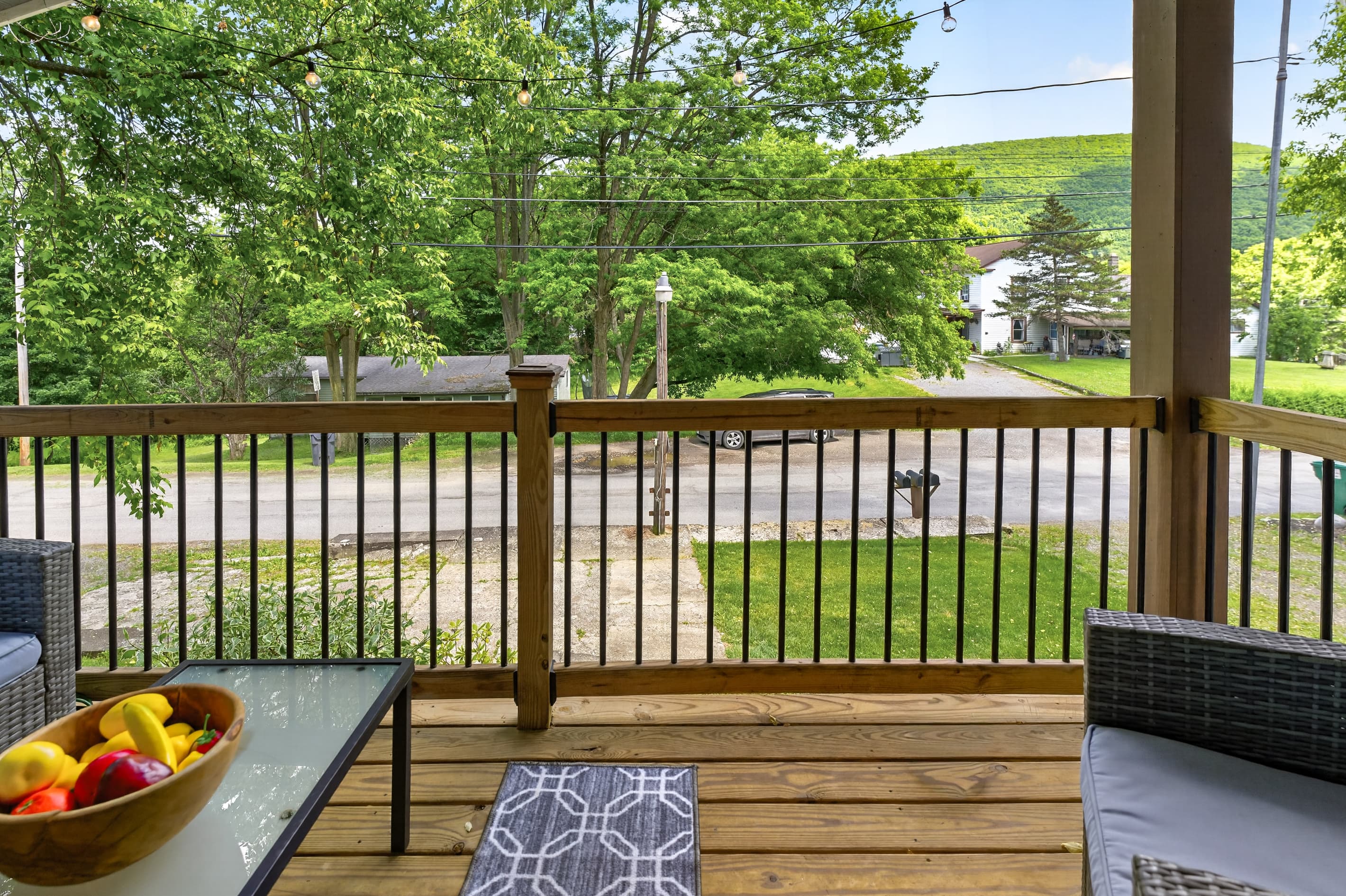 Deck seating overlooking mature trees