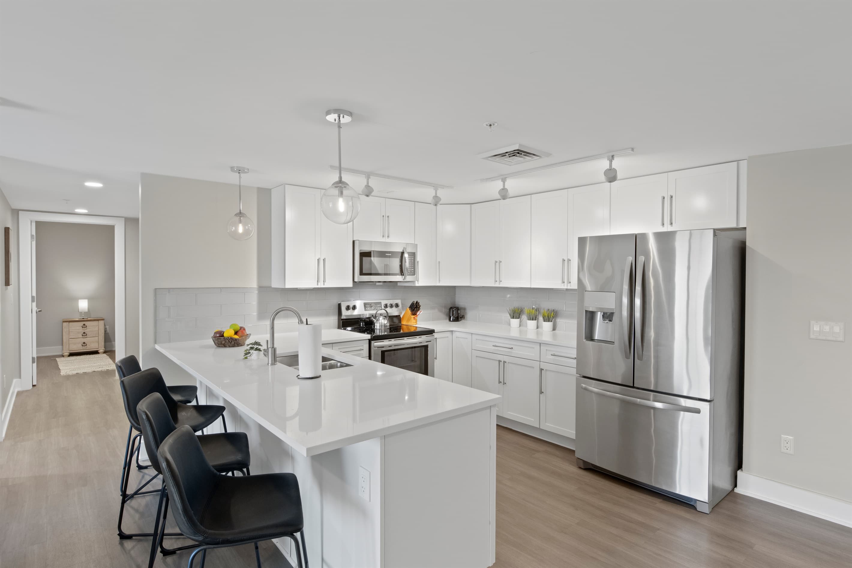 Kitchen with breakfast bar and pendant lighting
