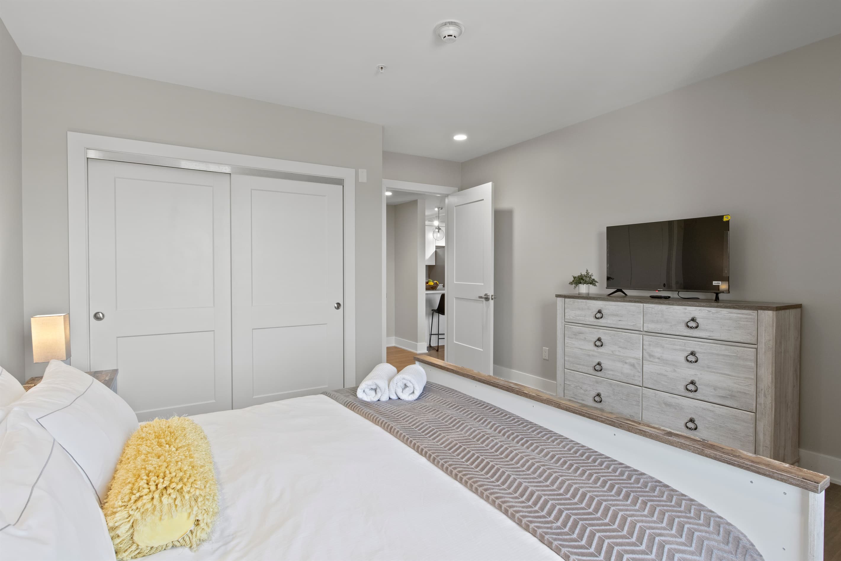 Bedroom with dresser and television